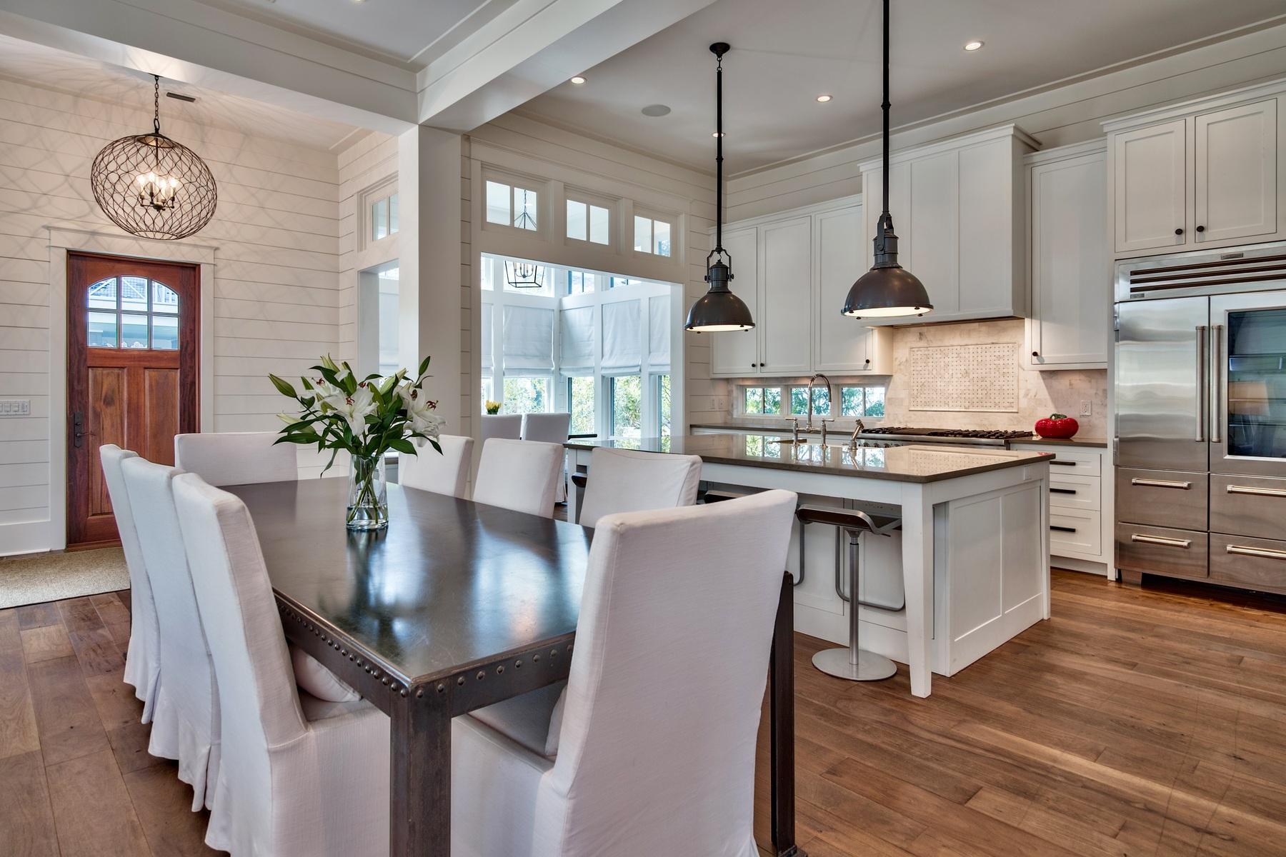 This beautifully detailed Cape Cod style masterpiece is located in the highly desired gated neighborhood of WaterSound Beach along Scenic Highway 30A. This magnificent 6 bedroom, 5 -1/2 bath home offers impeccable design and quality throughout. Step inside to a bright open floor plan, professionally decorated by Urban Grace Interiors, featuring walnut flooring, a gracious living area with gas fireplace, and state of the art gourmet kitchen with quartz counter tops, Carrara marble backsplash, and professional stainless steel appliances. Relax in the stunning master retreat with ensuite bath that includes marble counter tops and flooring as well as an extra large walk-in steam shower and separate soaking tub. Outside, enjoy the private heated pool with water feature as well as a summer kitchen. Other amenities include private elevator, Smart Home Technology, security system with exterior cameras, and perhaps best of all, this home is a short distance to the white sandy beaches, the Beach Club, parks and other recreational facilities. WaterSound Beach features walking paths, dune walkovers, and offers access to three golf courses and four resort style swimming pools located within the community. This is the home you have been waiting for that promises years of enjoyment for generations to come.