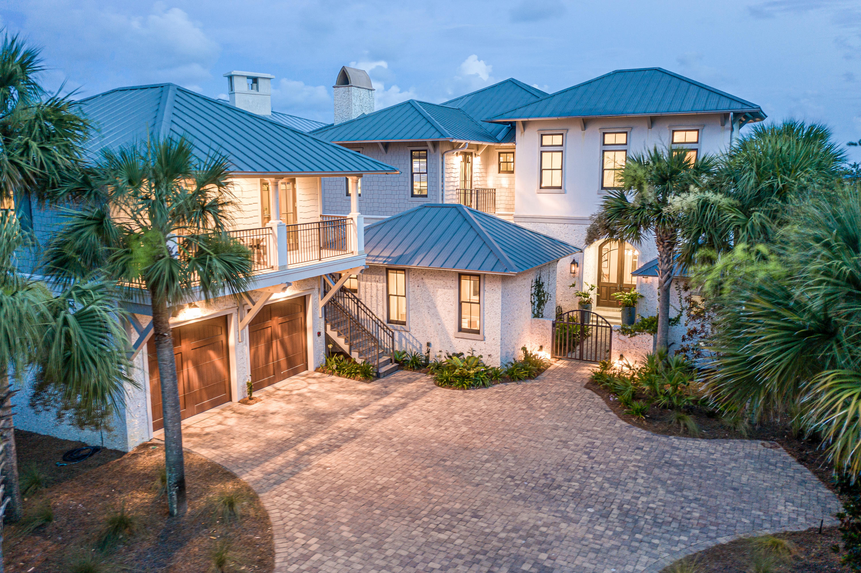 Located in The Retreat, one of the most desirable neighborhoods on 30a, 201 Bermuda Drive welcomes you in with stunning views of both the Gulf and Draper Lake. Located just steps away from The Retreat's private beach and Coastal Dunes, 201 Bermuda Drive is perfect as a primary residence or vacation rental, and is ideal for any size family. This gorgeous home includes a Main House, a Carriage House AND a Guest House: 201 Bermuda Drive will fit your needs to accommodate any large gathering of family and friends, while still remaining cozy and homey for smaller families and couples. The Main House is perfect for entertaining with a game room, a wet bar, access to your private pool, and plenty of living space with two bedrooms with Jack & Jill bathrooms and a power room. The main living area also includes a recently remodeled and redesigned kitchen with all new Thermador appliances, an open living and dining room, access to the beautiful courtyard with a masterpiece of a fireplace, an elevator that services all three floors, and a gorgeous wrap-around balcony to soak in the views. Head upstairs to retire in your wine/coffee bar loft, a secondary laundry room, and a secondary bedroom with ensuite bathroom and spacious master suite, with an attached library/den. The views are outstanding from the master suite!

This gorgeous home has been beautifully maintained since its completion in 2011, and boasts an all-new HVAC system and remodeled bathrooms in the main house. 201 Bermuda Drive has also been recently repainted, and new landscaping laid fresh. The Retreat does not allow short term rentals and is known for its privacy and seclusion. Don't miss an opportunity to call home one of 30a's best kept secrets and schedule your showing today!