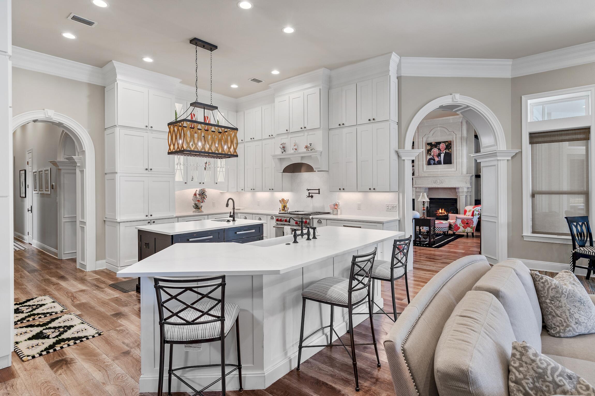 Welcome to this stunning Boswell-built estate home in the prestigious private community of Burnt Pine in Sandestin. Spanning 5,318 square feet, this exquisite residence boasts many luxurious features that will impress even the most discerning buyer.

Upon entering the home, you are greeted by custom cabinetry and a coastal-inspired fully renovated Chef's kitchen, complete with top-of-the-line appliances including a Viking range, steam oven, Subzero refrigerator, and two dishwashers. The spacious screened-in outdoor kitchen features a built-in Green Egg, perfect for entertaining guests.

Nestled within the confines of this luxurious estate, lies an incredible secret room, hidden from view and known only to a select few. Disguised as a built-in, this unassuming facade conceals a treasure trove of sophistication and indulgence: a state of the art wine cellar. 

The incredible redesigned pool area offers a tranquil retreat with bubblers, waterfalls, laminars, and an expansive hot tub with a spillover feature.

The master bedroom features a remodeled master bath suite with a steam shower, updated fireplace, and glamorous built-in closet areas. The air conditioning unit also comes equipped with HALO lights for air purification. This home is being offered fully furnished to include a golf cart, perfect for community outings!

Situated overlooking a lake on the 9th hole of the Raven golf course, this home truly offers the ultimate in luxury living. Don't miss the opportunity to make this exceptional property your own!
