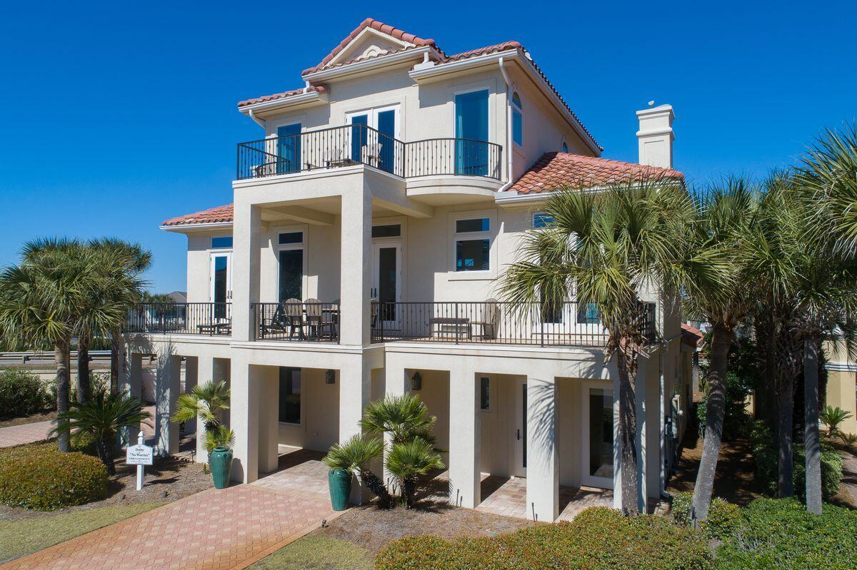 Unparalleled second tier positioning yielding 180 degree Gulf and western views define this beautifully remodeled and finely appointed coastal retreat located in the prestigious guard gated neighborhood of Destiny by the Sea. Reimagined by designer Leigh Ann Harris at Burrow Interior Design and beautifully remodeled by Andy Beno of Old South Homes, this five bedroom home offers exemplary quality with notable finishes and premium design appointments. This home has been utilized as a top producing rental property while being pristinely maintained with historic rental income ranging from $185,000 - $200,000+ annually. Gross annual rental projections exceed $250,000 for 2022 and could exceed $300,000 with a pool addition. The first level is adorned with beautiful peacock paver flooring juxtaposed a bright and spacious entry foyer anchored by an opulent curved staircase. There are two large bedroom suites on the first floor, each offering their own ensuite bathrooms and both enjoy south facing gulf views as well as a third bunk room which has been thoughtfully designed with sustainable coastal decor and also providing a private ensuite bath. The second floor is the heart of this gorgeous home offering exceptional south facing and western gulf vistas as well as a wide open floorplan anchored by the finely appointed chef's kitchen complete with custom cabinetry, stainless appliances (including a gas range) as well as a massive center island topped with sleek quartz countertops. The spacious living and dining areas are directly adjacent to the chef's kitchen offering both comfort and class with pecky cypress wood accents and gorgeous coastal decor which flows seamlessly onto the oversized south facing covered porch offering some of the best sunset vistas in all of Destin. The second level also features a secondary bedroom and full bathroom as well as a sizable laundry station. The third floor is the definition of a master retreat designed with expansive proportions while taking full advantage of exemplary gulf views from every corner of the space including the oversized walk-in closet. The ensuite master bathroom was beautifully designed with calcutta gold marble flooring and tile accents as well as a frameless glass shower, dual vanities, soaking tub and private water closet. Other notable features include ample parking and owner's storage as well as an oversized lot which has the potential to provide a future south facing private pool area. 

Residents in Destiny by the Sea enjoy guard gated and patrolled security as well as deeded beach access. The neighborhood also boasts access to a resort style community pool, onsite exclusive beach chair service including water accessories, clubhouse, onsite CAM manager and primely located within easy proximity to world class shopping, dining and entertainment.