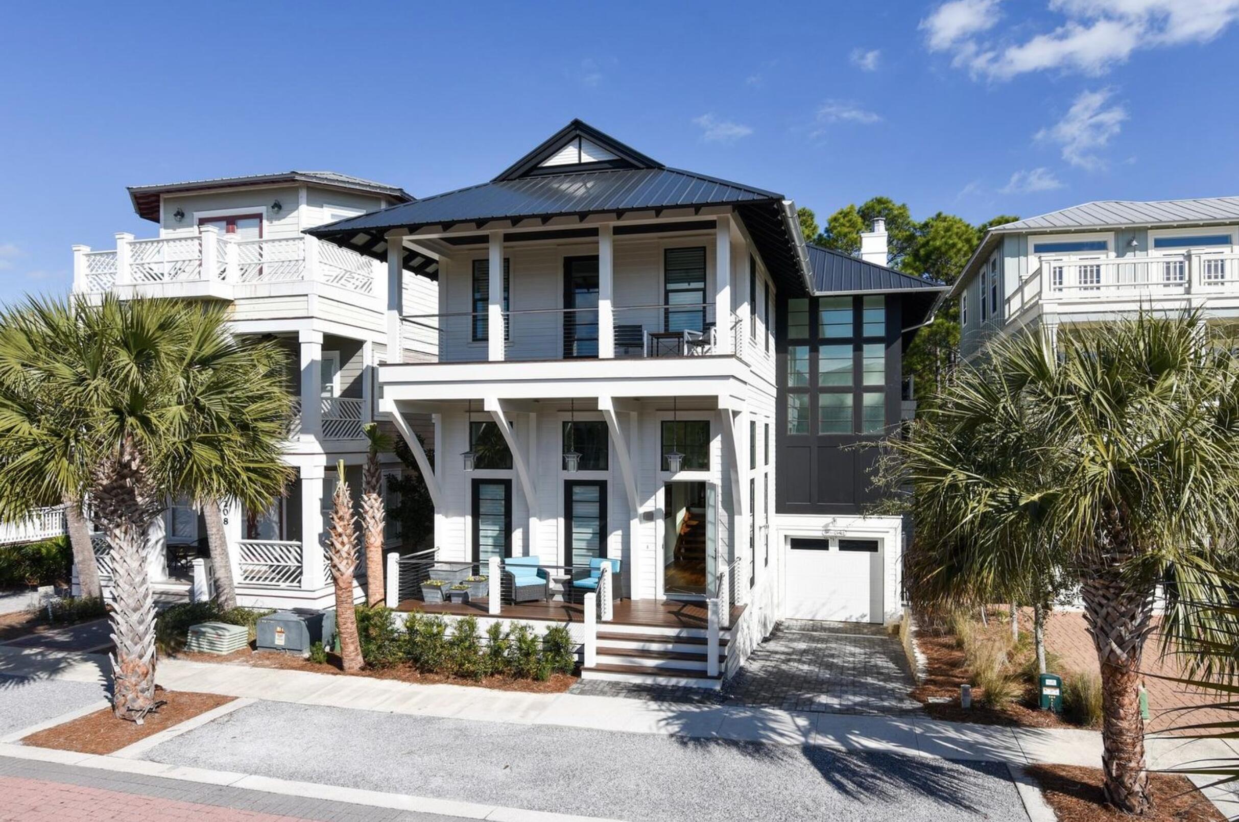Extraordinary custom built home featured in Destin Magazine. This gorgeous 5 bedroom, 4.5 bath MODERN Seacrest Beach home offers plenty of room for family and friends to unite in Luxury. A seamless flow from indoors to outdoors with modern elegance and comfortable everyday living. This beautifully decorated home boasts high end features including hardwood flooring, large transom windows providing lots of natural light, and well appointed chef's kitchen with granite counters and stainless steel appliances. With a spacious open floor plan including nano doors in living room that leads to one of three outside screened in porches, gourmet kitchen with two Fisher Paykel Refrigerators and pro style 48 Thermador range, two private master suites and two additional decks, one with gas fireplace. This property has a space for every need. With too many upgrades to list, you will also enjoy the one of a kind amenities this neighborhood offers, such as 12,500 square foot resort style community pool (2 short blocks), free neighborhood beach shuttle, 24 hour security and just a short walk to Alys Beach for shopping, restaurants and more. This property backs up to protected open space for privacy and peace.