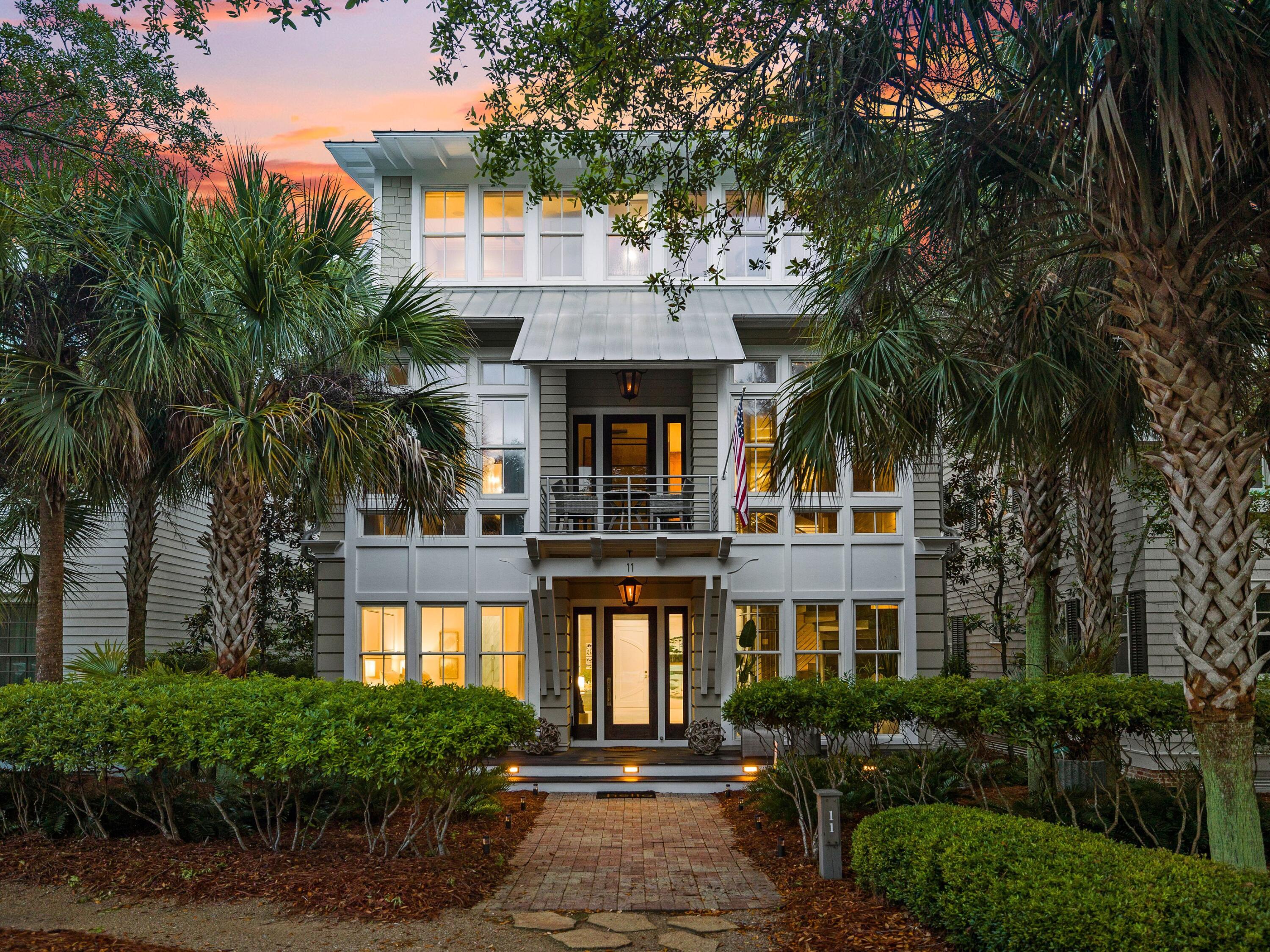 This contemporary WaterColor home has it all, including lake views and an enviable array of luxury upgrades. A brick-paved path leads to the covered front entrance, which opens to reveal a surprisingly modern home with a marble atrium and curving staircase wrapped around a futuristic glass elevator. Two guest suites, a custom bunk room and a two-car garage take up the first floor. Spread over four levels, this sophisticated home has walls of glass windows flooding the living space with natural light and framing pleasing preserve and lake views. The second level has a spacious open dining area, living room and bar equipped with twin wine coolers, a mini fridge and an ice maker. The gourmet kitchen is equally impressive and fully loaded with high-end appliances. Chefs and entertainers will love the oversized marble island, Thermador cooktop, stacked ovens and two Fisher & Paykel dishwashers. As well as a butler's pantry, there's a built-in coffee station and a dumbwaiter. Fling open the fully retractable doors and relax with family and friends on the screened porch overlooking views of Western Lake and preserve land. The third floor has a study with built-ins and a regal master suite designed as a luxurious sanctuary. The master bath raises the bar with heated floors, a rain head shower, a double-sided fireplace and soaker tub. Custom walk-in closets, a kitchenette and laundry complete the owner's luxury lifestyle. Glass doors open onto a private screened porch for enjoying your morning coffee with breathtaking views. A new second master suite was recently created from the former office and gentleman's bathroom. The top floor has an extensive sun deck for the ultimate entertaining. A neat glass house was added above the spiral staircase to keep it dry. It has a new gazebo creating a shady sitting area with bar and jacuzzi. Where better to relax and enjoy stunning sunset views across Western Lake? This outstanding home has a host of recent upgrades. These include new exterior paint, indoor and outdoor lighting, stripping and re-staining the stairway, adding a custom mural, new window treatments and kitchen improvements. Guest beds, bathrooms and bunk room were renovated along with a new outdoor kitchen and grill. This luxury residence is surrounded by equally magnificent amenities including a private Beach Club, tennis center and watersports on Western Lake.