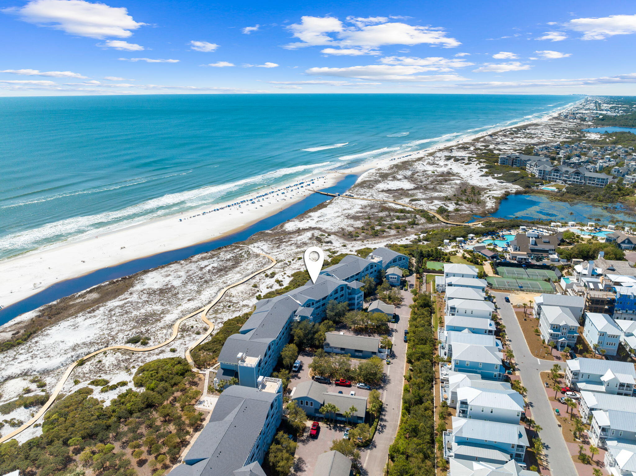 Designed by the acclaimed Graham Gund Architects, the residences at South Bridge Lane reinterpret coastal vernacular in a way that embraces the stunning landscape while inspiring a new vision of waterfront living. The low-density complex is strategically positioned behind the crystalline white sandy beaches and established dune vegetation offering short views of the local habitat and long views out to the sea. This highly sought-after floor plan spans two levels with over 2,100 square feet of thoughtfully designed living space in addition to an attached garage. Residence 109A offers luxurious living spaces designed for both relaxation and entertainment. The primary suite provides direct access to an expansive porch that spans the width of the first level, creating an inviting outdoor space. Exuding elegance, the primary ensuite features a soaking tub, tiled shower, and dual vanities. A custom bunk area with hand-crafted bunks and sliding barn doors for added privacy is also found on the first level. On the second floor, an open living and dining area are thoughtfully arranged for gatherings, with easy access to a spacious porch that offers views of the serene turquoise waters, seamlessly connecting the indoors with the outdoors. Additionally, two bedrooms on the second floor provide ample guest accommodations. The kitchen is equipped with high-end appliances, generous storage, and a convenient breakfast bar.

WaterSound Beach resides on 1,400 acres and over a mile of private white sugar sand beaches. The culmination of amenities and exclusiveness affords residents with the epitome of private coastal living while remaining geographically poised near the world-class dining and entertainment venues 30A has to offer. Amenities include a heated swimming pool, fitness center, and multiple community parks. Inquire today to coordinate a private viewing and start living the coastal lifestyle you deserve.