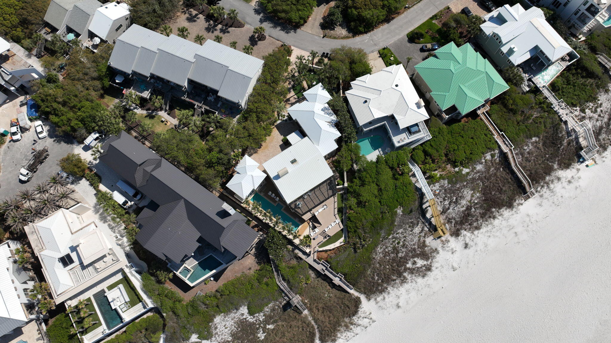 Welcome to 239 Pelican Circle—an exceptional Gulf-front home tucked behind the gates of one of 30A's most private and coveted streets. Just steps from Alys Beach and minutes from Seacrest and Rosemary, this property blends location, privacy, and direct beach access into a rare opportunity along the Emerald Coast.

Set on a generous .34-acre lot, this five-bedroom, five-bathroom property includes a detached guest house with its own private suite—perfect for visiting guests, extended family, or a private workspace. The layout is ideal for both full-time living and rental income, offering multiple living areas, ample outdoor space, and a seamless connection between indoor comfort and Gulf-front views.

Recent updates include brand-new impact-rated sliders and windows, a fresh full exterior repaint, and a completely redone outdoor deckall designed to enhance the home's durability and coastal appeal. Inside, natural light pours through expansive openings, highlighting the panoramic Gulf views from the main living area and primary suite.

Outdoors, enjoy a spacious deck perched above the dunes with direct, private beach access. Whether you're hosting a sunset dinner or enjoying a quiet morning coffee, the setting is unforgettable.

With a strong rental track record and walkability to Alys Beach, Rosemary, and Seacrest's best shops and restaurants, this home is as much a smart investment as it is a personal retreat. Properties like thisGulf-front, low-density, and south of 30Ararely become available. 239 Pelican Circle is your chance to own something truly special along 30A