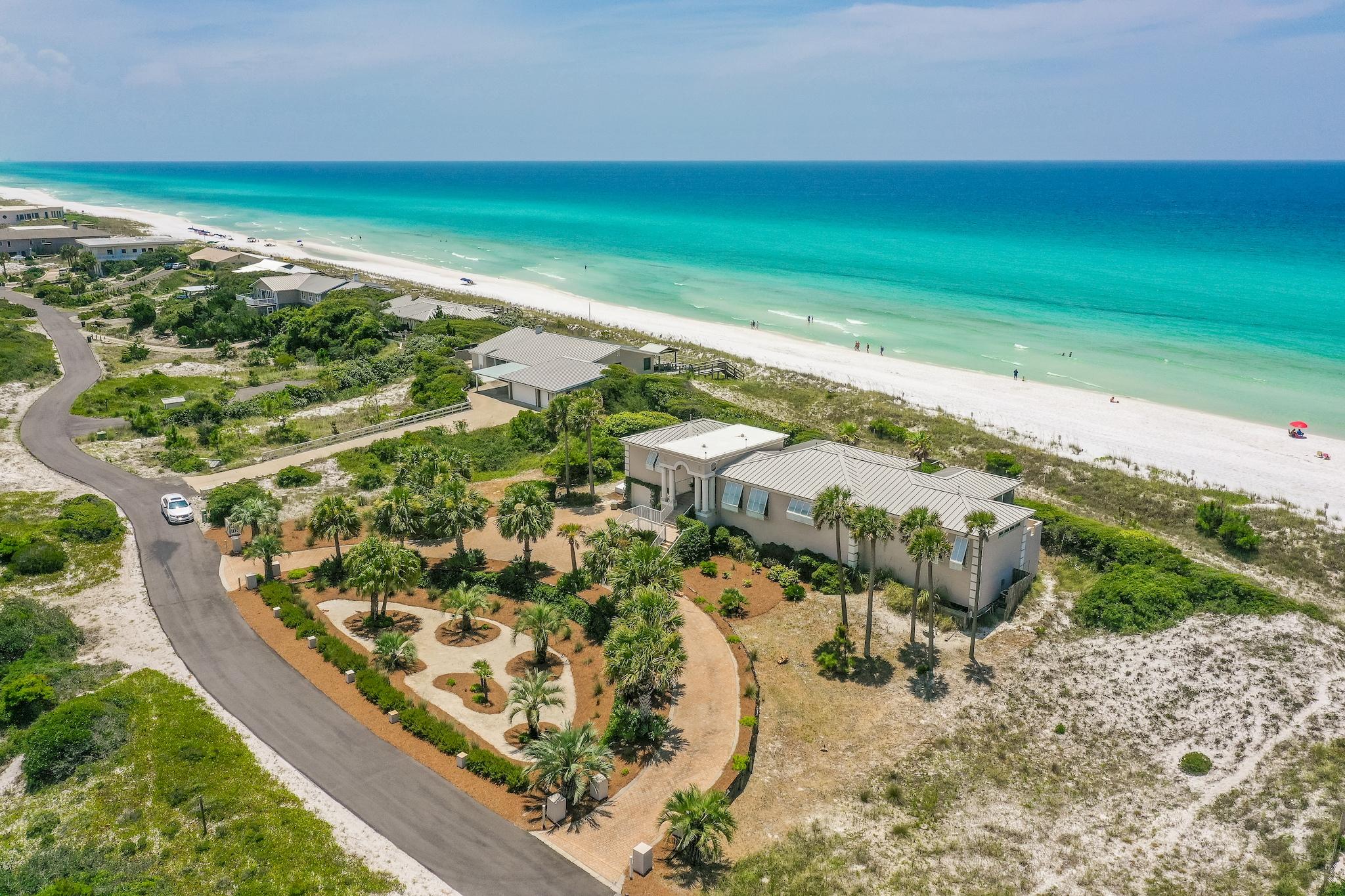 Experience an unparalleled amount of gulf frontage with this gorgeous property, boasting an unheard of 265 feet on the Gulf of Mexico. This is one of the largest privately owned Gulf-front parcels in Walton County. Enjoy panoramic views of the Emerald Coast from almost every room. Take the elevator from the garage up to the main level, where every room is on one floor. Situated on over an acre and a half, the open floorplan of this home allows for expansion, or start from scratch and build to suit on this amazing lot. Located within the enchanting gated community of Four Mile Village, boasting miles of walking trails, access to a 50 acre coastal dune lake and 2,200 fee of private beach access. This home has been very well maintained and cared for. The exterior of the home was resealed and  painted in 2016, and the roof was also replaced that year. Other exterior upgrades include Lexan hurricane shutters, 3M UV protective glass and a positive Ion system for lightening diffusing.