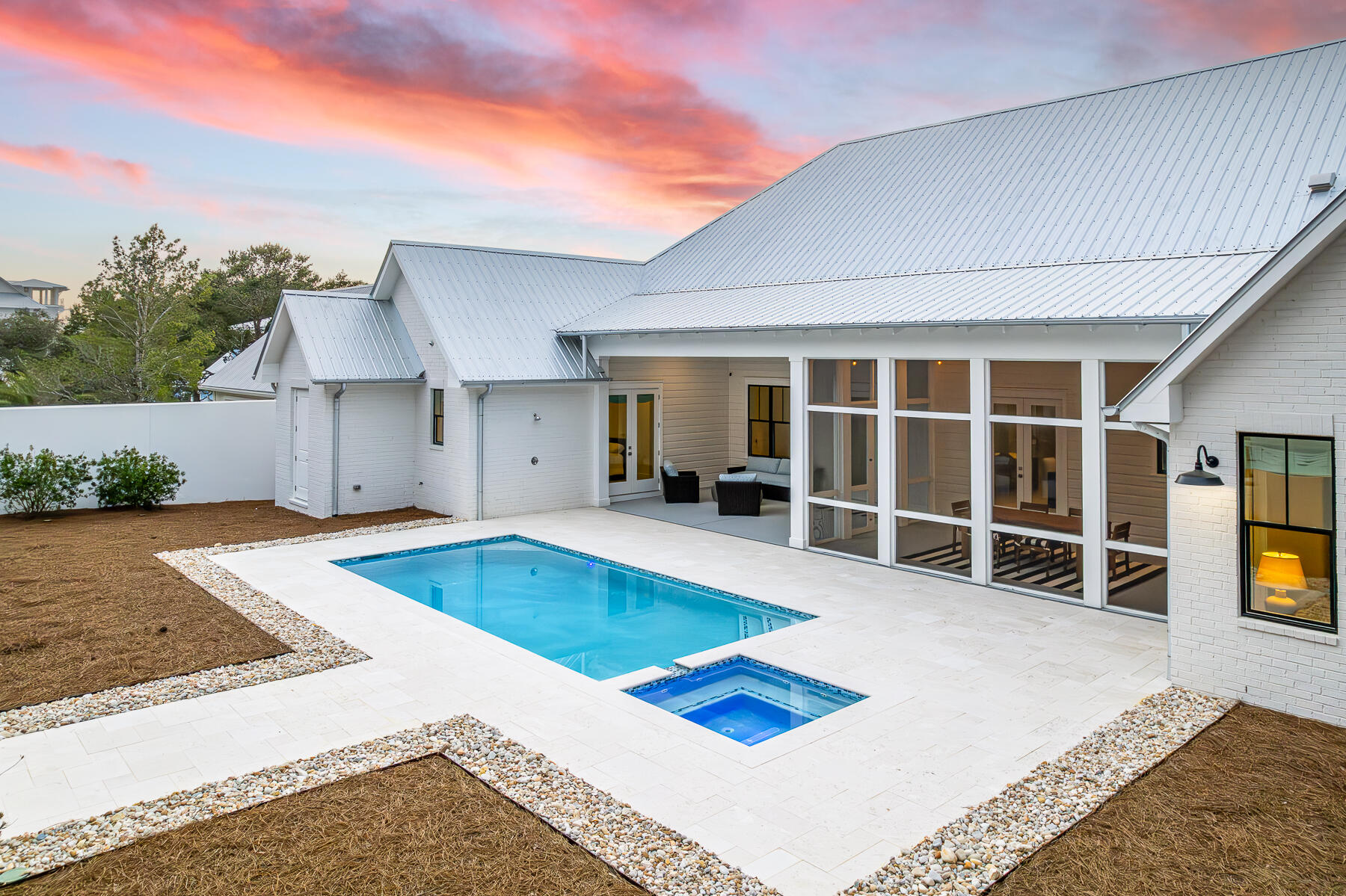 This newer build one story luxury home was designed with privacy in mind set in Blue Mountain Beach on a 1/2 acre lot with 2 car oversized garage. This home features 5 bedrooms and 4.5 bathrooms with additional office/flex space making it ideal for primary residence, second home or rental investment. The upgraded lighting, window shades and furnishings are the epitome of luxury in this private beach oasis.  The north wing of the home features a large primary wing with access to patio, large double vanity bathroom, spacious walk in closet to oversized laundry room. This layout opens to pool and patio as well for a true indoor/outdoor living.  The open floor plan with a chef's kitchen features high end appliances with butlers pantry, wine fridge, beverage fridge and plenty of storage. The large island on the kitchen leads to dining area with custom lightening above leading into sitting area with fireplace. This room has a flex space that could be an ideal office or bunk room for additional guests. The living space is extended to large screened in porch overlooking pool and spa featuring summer kitchen for ultimate in entertainment. The outdoor pool is an oasis with another fireplace overlooking the peaceful setting with additional storage and an outdoor shower. 

On the south wing of the home are 4 bedrooms and 3 full bathrooms. This provides a great space for guests or family members. The home is set back from the road on this large lot offering privacy from each room. 68 Mountain Top Dune Drive is offered furnished as shown with high end furnishings and custom drapery from local Shade and Drape Company in Blue Mountain Beach. 

The garage is oversized wit one bay measuring 25 feet in depth to accommodate a 23 foot boat or Tesla Cyber Truck.  This location is in the non HOA community of Blue Mountain Beach keeping of cost of ownership low. This residence is surrounded by homes on similar sized lots offering peace and tranquillity just off 30A.  There are multiple beach access areas just at the end of the road as well as miles of trails in Point Washington State Forest less than .5 from the home.  Relax by the pool after a long day at the beach or hop on your e bikes (new and included in sale) to explore all the surrounding towns along 30A.  This home is a immaculate as if new construction.