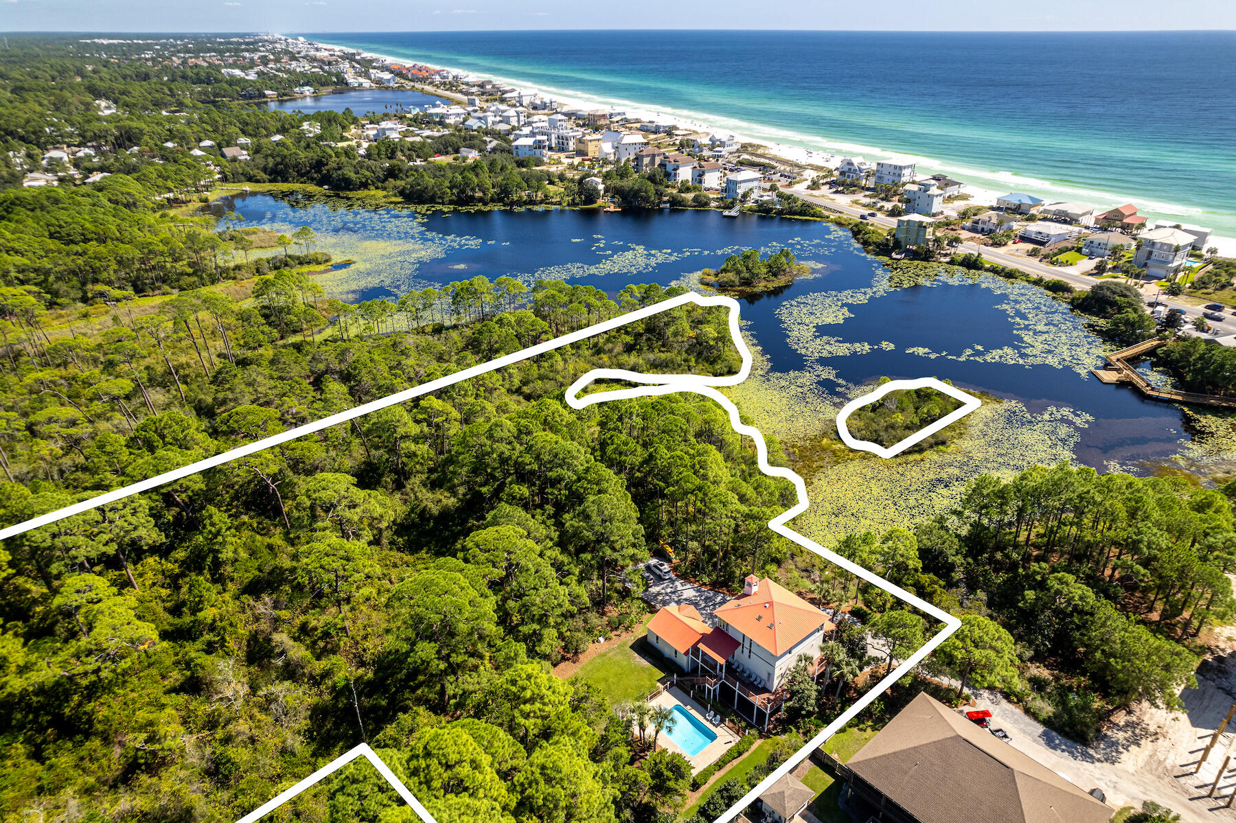 Introducing a remarkable investment opportunity in the heart of Dune Allen Beach! This expansive 5.5-acre parcel presents a rare canvas for creative development, with neighborhood infill zoning. Situated along the tranquil shores of Allen Lake, supplying a picturesque backdrop for potential homesites. Benefiting from its coveted location, this property offers proximity to pristine beaches, upscale amenities, and the vibrant coastal lifestyle that 30A is known for. The versatility of this land is unparalleled, offering the potential to construct multiple waterfront and non-waterfront residences, ranging from 2 to 8 homes per acre (more info can be provided). With the ability to subdivide the land, investors have the opportunity to tap into the growing demand for premium real estate in the area. The property also includes a three story home with pool. The property is graced by natural wetlands, adding an extra layer of environmental significance. Mitigation is required to preserve this valuable ecosystem to allow for thoughtful development. Rarely does a parcel of this size, location, and zoning become available, making this an extraordinary chance for visionary developers.