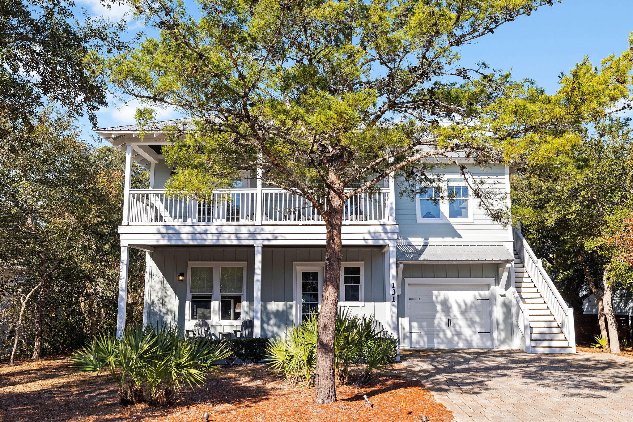 Positioned in the heart of Inlet Beach with the rare advantage of deeded private beach access, 131 Clareon Drive offers a thoughtfully designed coastal residence where comfort, functionality, and effortless living come together.
 Spanning 2,596 square feet of heated and cooled living space, the home features four bedrooms and four bathrooms, with interiors that balance clean design and everyday ease. Hardwood flooring flows throughout the main living areas and bedrooms, complemented by tiled bathrooms that add both durability and refinement.

The kitchen is designed for gathering, offering generous cabinetry and expansive counter space that supports everything from casual mornings to shared meals. Nearby living spaces feel open yet inviting, creating a natural flow for both quiet evenings and entertaining.

A standout feature of the home is the custom-built bunk room, complete with its own wet bar, offering a flexible space that adds character and functionality. Throughout the home, abundant storage has been thoughtfully incorporated, enhancing livability without compromising design.

Outdoors, a large private pool anchors the backyard, surrounded by a shaded lot that offers a sense of privacy and comfort throughout the day. Whether enjoying a morning swim or an evening under soft coastal light, the outdoor space is designed to be an extension of the home itself.

Located within a community that allows short-term rentals, the property offers versatility alongside its coastal appeal. With deeded beach access, well-appointed interiors, and carefully considered spaces throughout, 131 Clareon Drive presents an opportunity to enjoy the Inlet Beach lifestyle with both ease and distinction.