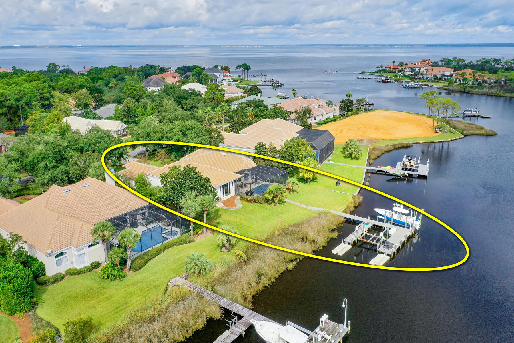 JUST REDUCED! Fantastic, furnished opportunity to own and enjoy the lifestyle of this fabulous waterfront estate situated beautifully on scenic Jones Bayou in the master-planned, gated community of Kelly Plantation, which offers many amenities along with the perfect mid-Destin location for enjoying the best of Florida's Emerald Coast! The one-story floorplan is perfect for those who want the convenience of its functionality and livability! The existing dock steps from the wonderful pool will allow one to capture the essence of the outdoor lifestyle of Florida and the gorgeous waters of Destin and the Gulf of Mexico! 

The remodeled, spacious kitchen features Cambria countertops, a large island, walk-in pantry, breakfast bar, wolf appliances and subzero appliances... Vaulted ceilings provide an airy feeling, and disappearing sliders to the fabulous fully screened lanai with pool and fountain/spa further enhance the indoor/outdoor living of this waterfront lifestyle. The dock includes slips and two new boat lifts. Other pluses include a host of Seller upgrades including remodeled master suite, a newer HVAC, water heater, pool equipment, new flooring in the office and master bedroom, driveway, and so much more! This property is a must see, please call to schedule your showing! Subject property is being sold furnished, some exclusions shall apply.