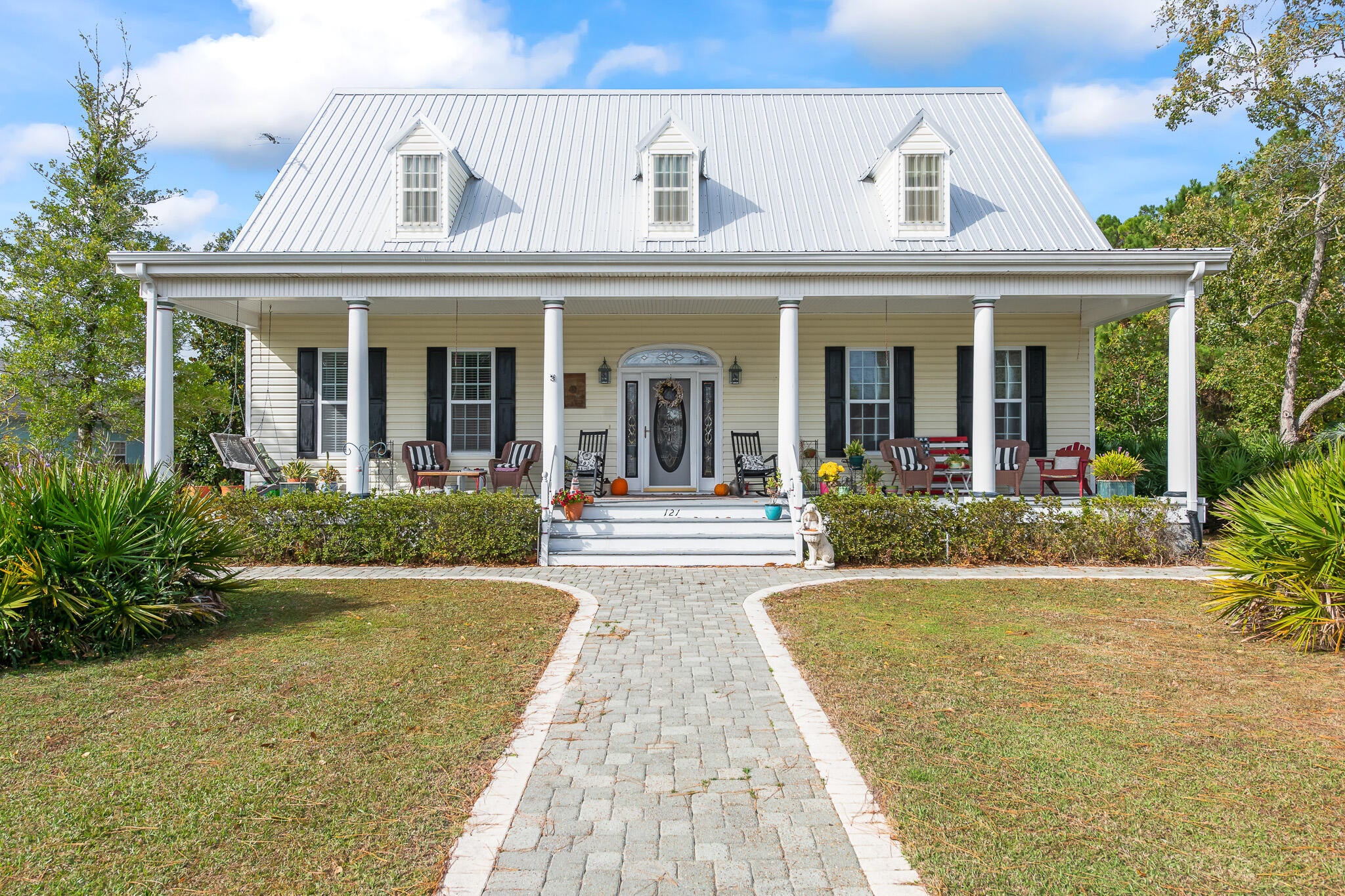MOTIVATED SELLER! Classic and Captivating, this home harmonizes the Carolina's timeless charm with the alluring amenities of Florida's Emerald Coast. This southern cottage design, featured in Southern Living magazine, was created by William E. Poole Designs INC and was ''built to look as though it has always been there''. Extraordinary details have been conscientiously joined with exquisite craftsmanship in this custom 4 bedroom home including an upstairs studio and wet bar. Notable features include a sprawling front porch, custom arched entry way with adjoined built-in bookshelves, Australian Cypress hardwood flooring and handrails, 10 ft ceilings, fireplace, private dining room, 2 car garage, large backyard and outdoor shower. *New roof in 2019 and new dishwasher and farmhouse kitchen sink 2022. This is a special one you have to see! Information contained within this listing such as square footage, is deemed to be accurate but is not guaranteed. Buyer to verify.