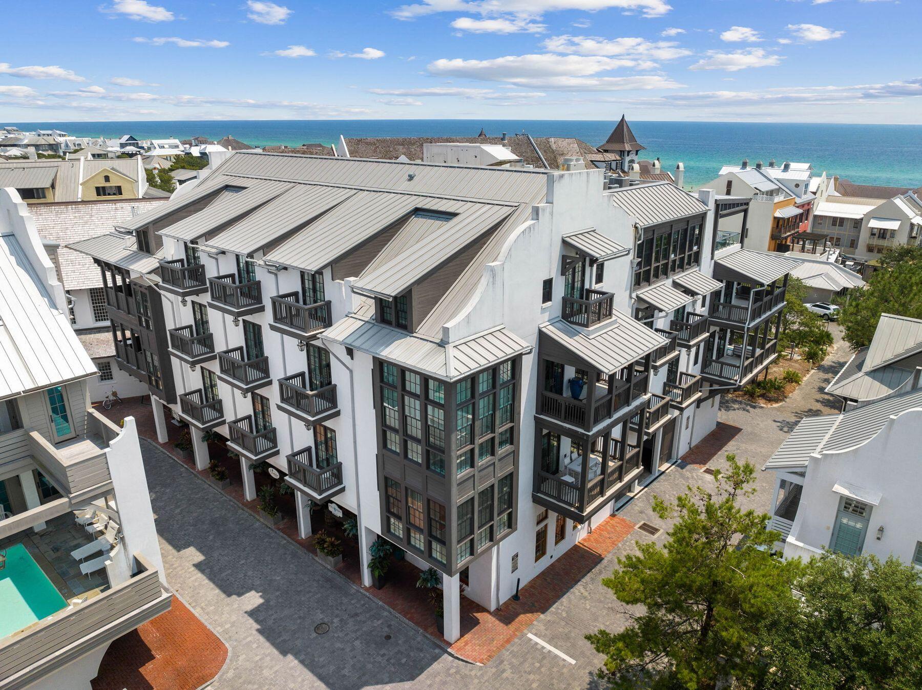 Elegance meets coastal sophistication in this luxury gulf-view condominium, perfectly positioned south of 30A in the heart of Rosemary Beach. Located within The Orleans, one of the area's most exclusive and architecturally refined addresses, this residence offers a seamless fusion of modern design, privacy and timeless coastal charm. Just steps from the sand and boardwalks G and H, this rare offering is ideally suited for those seeking a refined beach lifestyle with all the comforts of a high-end retreat. Thoughtfully designed for comfort and privacy, the spacious layout features two king bedrooms, each with an ensuite bath and private balcony, along with a charming twin bunk room with its own full bath. Gulf views and rooftop panoramas of Rosemary Beach are showcased from three distinct  balconies, providing a serene escape morning to evening. Finishes throughout the home reflect a curated sense of luxury: PID high-performance hardwood floors, waxed Calcutta marble, Caesarstone countertops, and custom cabinetry by Trustily are complemented by top-of-the-line appliances, including a Wolf range, Sub-Zero refrigerator, Asko dishwasher and Blanco Quatrus sink. The open kitchen and living space are outfitted with Waterworks and Dornbracht fixtures, Visual Comfort lighting and a blend of clean lines and coastal textures, designed by Cappoli Interiors Palm Springs. With one assigned parking space in the enclosed garage and access to Rosemary Beach's renowned amenities --five community pools, a private beach, and HOA beach service-- this residence represents an exceptional opportunity to own a turnkey, modern coastal home in one of 30A's most iconic communities.