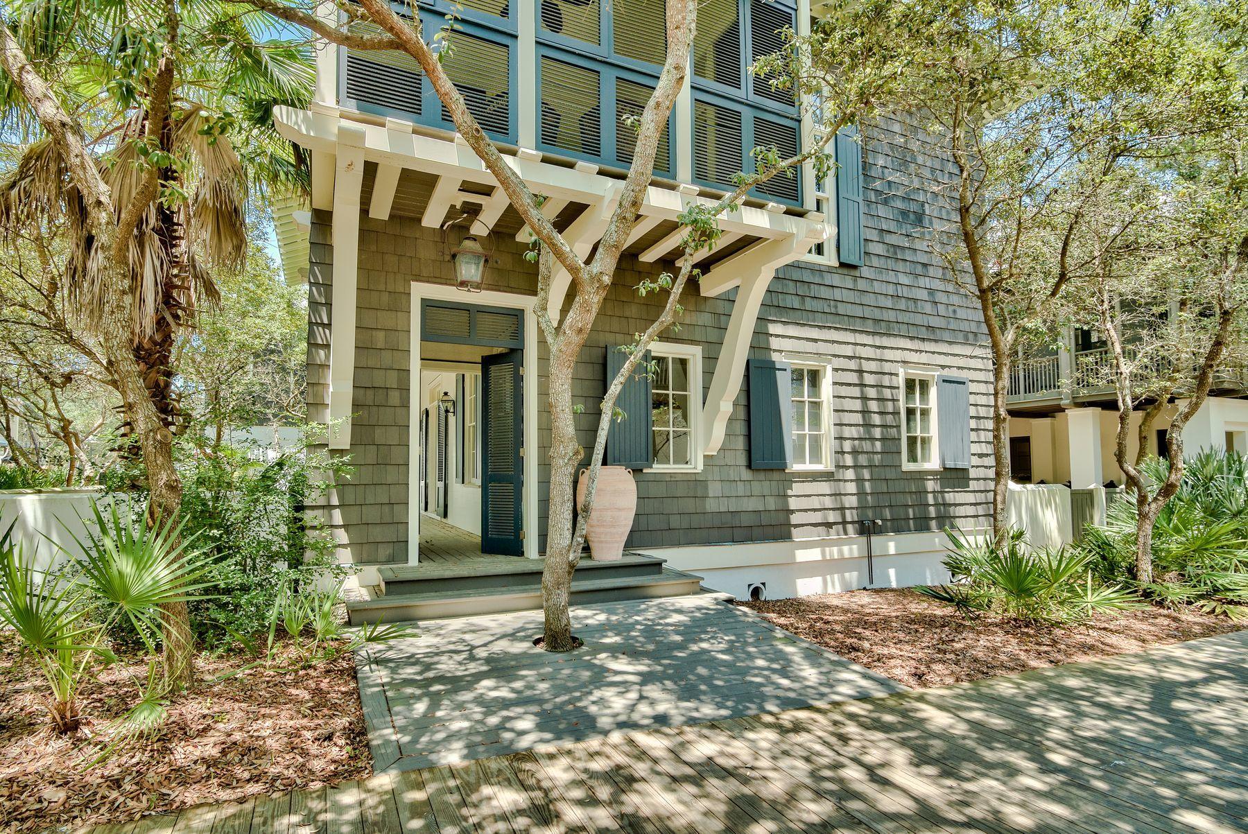 INVESTOR OPPORTUNITY! Nestled South of Scenic Highway 30A in the heart of Rosemary Beach, this quintessential Bobby McAlpine designed coastal retreat is an investor's dream. The spacious 6 bedroom, 6.5 bathroom layout offers ample opportunity to create a true masterpiece through countless rejuvenation options.
The grand foyer of the first floor is flanked by a spacious living room on one side and dining/kitchen on the other. Upon taking the stately staircase to the second floor, you will find a master suite and two guest suites, each with en suite bath. The wrap around porch of the second floor also features a sleeping porch directly off of the master bedroom. The third floor is home to a bedroom, bunk room, and living area. Lastly, the carriage house features a bedroom, bathroom, kitchen, and space for an additional sleeping area.