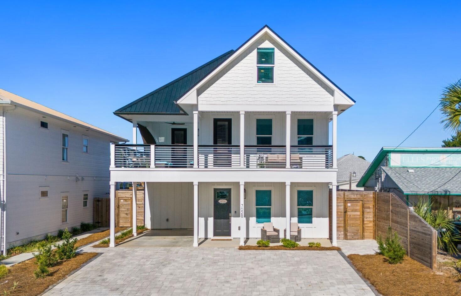 CURRENTLY UNDER CONTRACT, SELLER ACCEPTING BACKUP OFFERS - A premier investment and luxury coastal retreat, this custom beach home is positioned just a short 5-minute walk from Public Beach Access 15 and the iconic emerald waters of Panama City Beach. Purposefully designed to host large groups, it sleeps up to 19 guests and delivers impressive rental projections exceeding $130,000 annually. The open main level showcases a gourmet kitchen with granite countertops, stainless steel appliances, and walk-in pantry flowing seamlessly to the covered patio, private pool, and outdoor shower. The primary suite provides resort-style comfort with a soaking tub, walk-in shower, and spacious closet, while multiple bunk rooms including a third-floor bunk suite with lounge area enhance rental versatility. A second-floor family room with a wet bar opens to a sunset-view sundeck ideal for entertaining. Perfectly located on the desirable East End near local favorites like Schooners and FINNS Barista Bar & Snack Shack, this fully furnished property offers superior guest appeal and proven performance in one of PCB's strongest rental corridors.