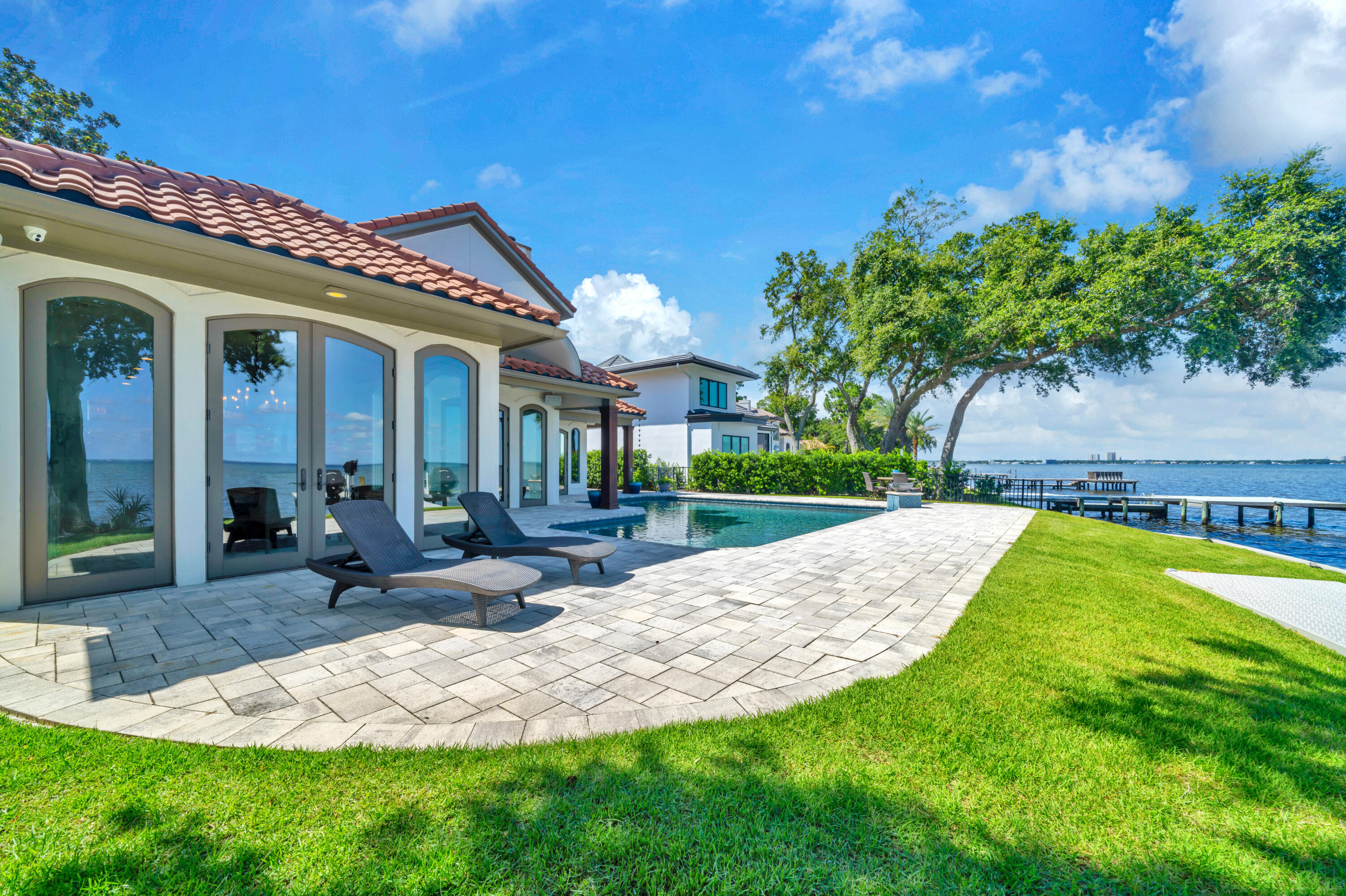 WOWZA! BIG PRICE REDUCTION! 
Amazing bay front home in Burnt Pine.
Don't miss your chance to own this extraordinary bayfront luxury home in the exclusive Burnt Pine community at Sandestin Golf & Beach Resort.  This single-level luxury home features 4 bedrooms (Plus a bunkroom) 4 full baths, 2 half baths, and 3,313 square feet of beautifully designed living space. Roof replaced in 2008.
Set on 70 feet of serene waterfront, the property boasts a private dock with two boat lifts, a renovated pool, and fresh, professional landscaping. The home's open-concept layout is enhanced by vaulted ceilings, a custom fireplace, and a wall of windows that flood the living spaces with natural light and frame breathtaking western sunset views over the bay. The heart of the home is the spacious, designer kitchen, featuring a massive island, top-of-the-line stainless steel appliances, and plenty of room to entertain. Each of the four main bedrooms offers a private en-suite bathroom, while the bonus bunkroom is perfect for guests or kids. The seamless indoor-outdoor flow makes this home ideal for both full-time living and luxurious vacationing.
Located in Burnt Pine, Sandestin's most exclusive gated community, residents enjoy access to world-class golf, tennis, a full-service marina, private beach access, and an array of shopping and dining options within the resort.
Don't miss this once-in-a-lifetime opportunitybayfront homes in Sandestin rarely come available.