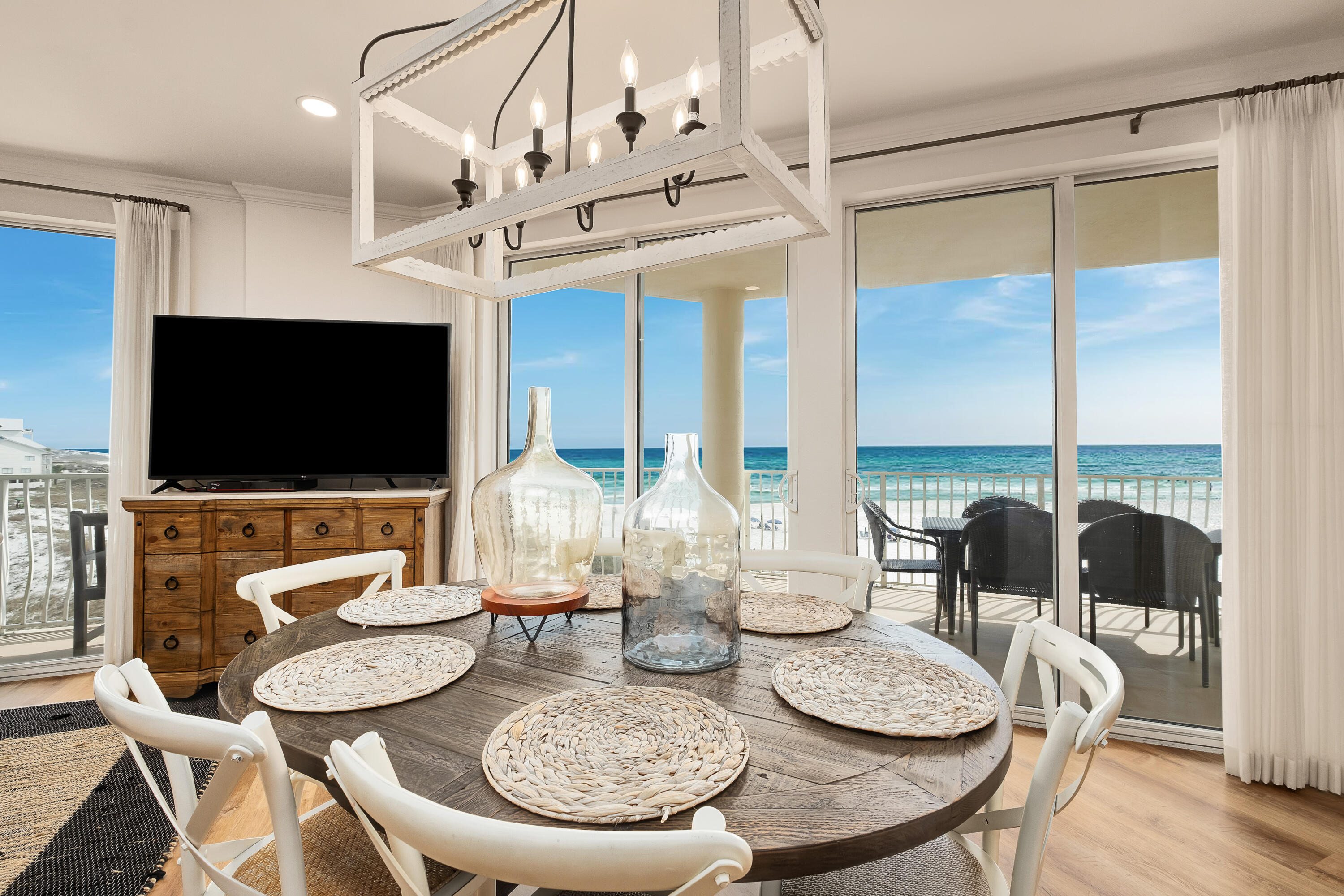 Few condos can match this gem, which boasts three full bedrooms all with ensuite baths, gulf views and direct balcony access. It's also one of the few condos in the building with direct-facing gulf views from its third-floor location and a deeded covered parking space. Step inside this fully updated unit to appreciate the remarkable fixtures & finishes that draw you in from the moment you set foot in the foyer. Light wood flooring, shiplap walls & fresh neutral décor entice you through the bright open living space to a series of floor-to-ceiling doors framing breathtaking gulf views. The expansive wraparound balcony is perfect for entertaining with panoramic views along the Emerald Coast. Designed with the ideal host in mind, the large custom kitchen has new veined quartz countertops with waterfall edges, grey tile backsplash, stainless appliances and a wine fridge for serving perfectly chilled drinks. Draw up a seat at the island breakfast bar for drinks and snacks while the cook conjures tasty meals. The grand master suite includes a quiet sitting area and enlarged walk-in closet. The adjoining ensuite bathroom wows with a double vanity, glass shower enclosure and an oversized oval tub for heavenly soaks after a busy day shopping or playing golf. There's a second guest suite with a king sized bed and a bunk room for five to accommodate visiting family and friends. Head over the dunes to the beach via the level private boardwalk. Start the day with a morning stroll with wildlife or rent kayaks and paddleboards from the onsite rental company. The condo comes with dedicated parking, gated pool and beach access, available storage lockers and closets, and a host of sports and top-notch amenities. Two gulf-front pools (one heated), hot tub, a sauna, steam room, fitness center, pickleball and tennis court provide endless opportunities for an active outdoor lifestyle. After a fun-filled day, return to the peace and tranquillity of this beautiful home to relax with sunset drinks. Ideal as the perfect second home, this glorious beach retreat could also be a lucrative investment rental.