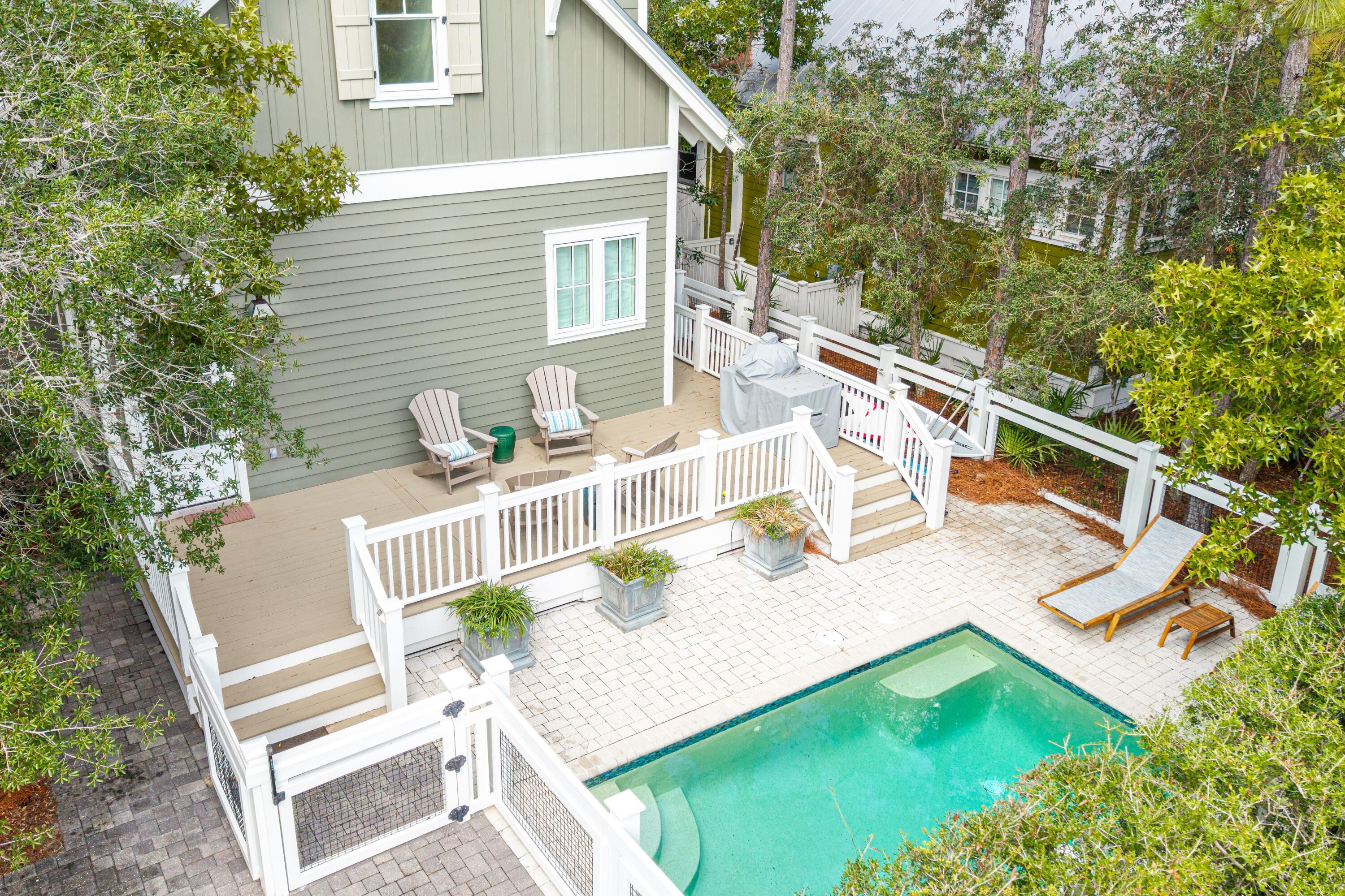 Private Pool | Corner Lot | Prime Watercolor Location
Beautifully situated on a corner lot, this home offers three parking spaces, park views, and open space on two sides. Mature trees provide a sense of privacy while still allowing full sun around the pool.  The main level features an open kitchen and living area, screened-in porch, half bath, and a spacious primary suite. Upstairs includes three en-suite bedrooms, one of which is a bunk roomâ''perfect for family or guests.
 Interior highlights include hardwood floors, high-end finishes, and quality furnishings. The large kitchen is equipped with a Thermador six-burner gas range with grill, ample counter space, and a generous island, ideal for entertaining.  
Enjoy convenient access to Camp Watercolor, tennis courts, Publix, and Seaside. Homeowners also have access to the Watercolor Beach Club, multiple community pools, nature trails, and beach access, all within a golf cart and biking community.
This home is offered fully furnished and is ideal as a full-time residence, second home, or rental investment.