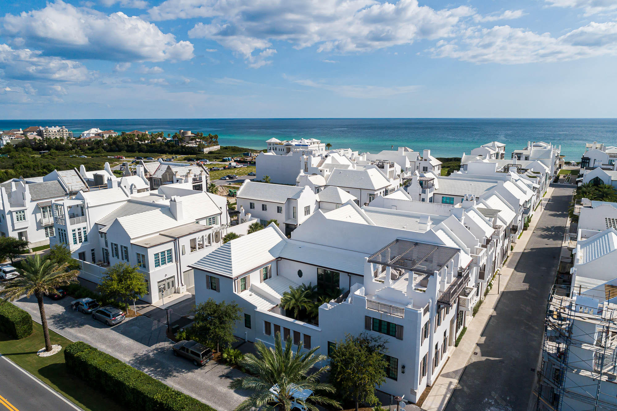 Gracefully poised on a prominent corner site on the Gulf side, 25 South Charles Street presents a highly coveted Alys Beach location, with breathtaking Gulf views through the main street corridor.  This brand new luxury residence was just completed in the Spring of 2020, designed by Khoury-Vogt Architects and constructed by Gulfview Construction.  An ideal and spacious layout, the five bedroom home, with private courtyard pool and two-car garage, lends a comfortable coastal lifestyle, with multiple outdoor spaces, bonus gathering spaces, and an exceptional rooftop terrace for lounging and entertaining while taking in stunning Gulf views.  Furnishings have been fully appointed Tracery Interiors, and the home will convey fully furnished. Upon entering the main door from South Charles Street on the west side, the first level living, dining, and kitchen area are an open and inviting space with ample light as you move through the doors that flank the east wall of the room to a covered loggia with grilling and dining space and intimate private courtyard with a charming pool and firepit gathering. A guest master bedroom, with en suite bathroom are conveniently situated on the first level's east side, with a private orientation and ideally opening to the courtyard. A two-car garage provides valued parking and storage spaces for bikes and beach gear.  A main laundry room is located on the first level, and there are two additional washers and dryers in the home.  The second level separates into two wings, with the west side dedicated to the master suite and the upper deck entertaining areas and the east side home to the guest rooms.  Mounting the stairwell west, you have a landing area with a half bath, a morning kitchen, and a door to exit to the outdoor court terrace and the private doorway entering into the master suite.  This terrace is appointed with a comfortable sitting area and can also be accessed from the master suite French doors.  Mount the exterior stairs from this second level courtyard terrace to access the larger, 912 square foot rooftop terrace which provides a large entertaining space, with wet bar.  Enjoy sunset drinks or dining al fresco with stunning views over the truly special architectural rooftops as well as an unobstructed view corridor of the Gulf.  The master suite and large en suite bathroom with exquisite soaking tub and large walk-in steam shower. A large walk-in closet houses a vanity area, custom built-in cabinetry, and a stackable washer and dryer.  The suite opens to the court terrace, overlooking the courtyard below and providing access to the upper terrace. On the east side of the residence, there are three additional guest bedrooms, one being outfitted with custom bunks to sleep four, two bathrooms, a laundry area and a cozy gathering space that can be used as a media room, playroom or extra living area. Alys Beach offers a truly remarkable lifestyle experience, with exceptional amenity offerings including Caliza Restaurant, Zuma Fitness Center, luxury boutique shopping and dining, and the upcoming Beach Club, private to owners.  Discover the unmatched coastal lifestyle of Alys Beach, Florida.