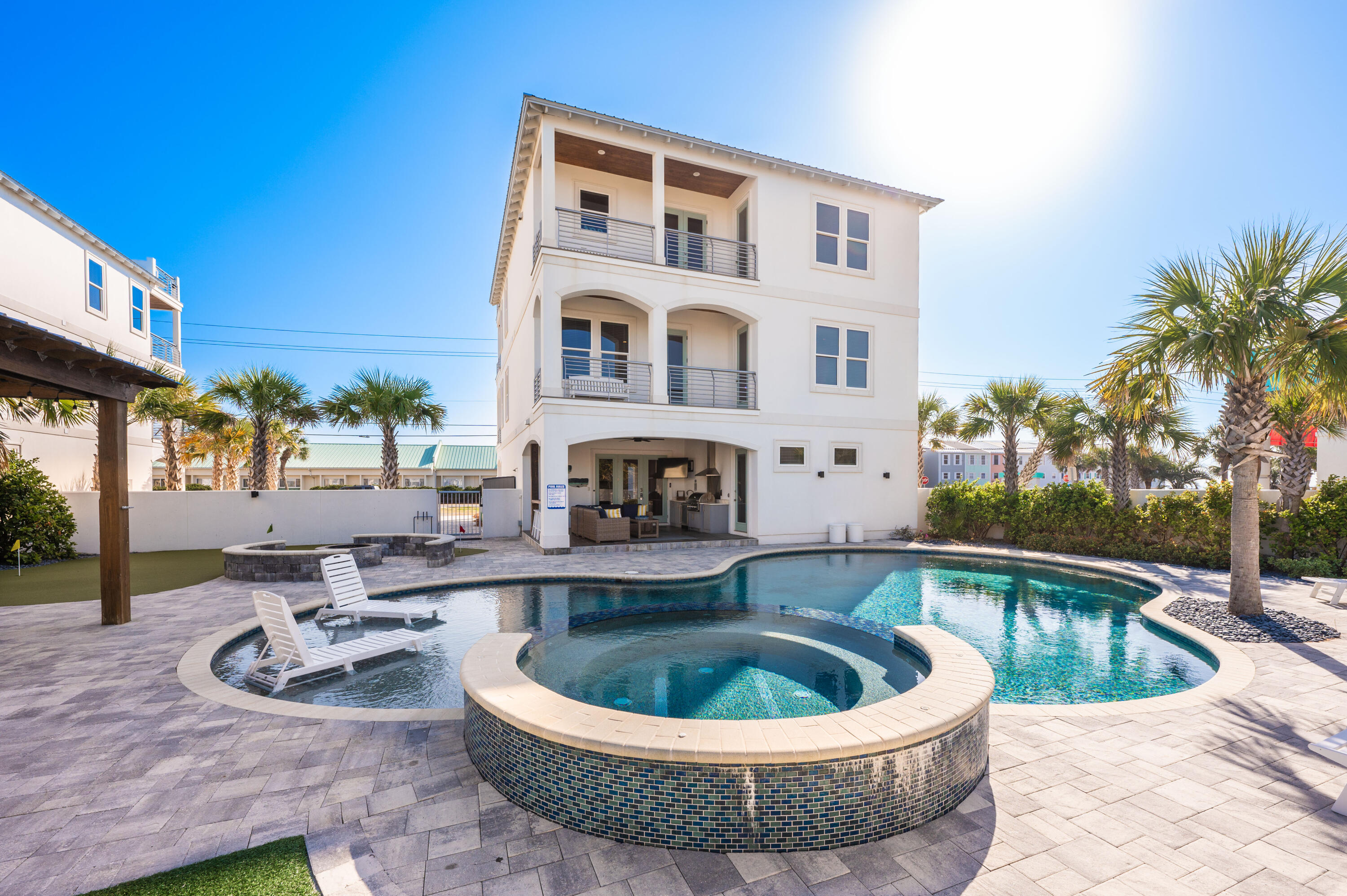 Seller says 'SELL' and DROPPED THE PRICE $650,000. Don't miss this opportunity.  Renovated. Updated. Upgraded. No HOA, so low cost to own. Relax: it's time to have fun at the beach! One of the largest lots on Scenic Gulf Dr. Sleeps 28 with king-size en suite bedrooms + 2 bunk rooms. Your private mini resort, vacation fun is built in: plentiful outdoor space; putting green; outdoor kitchen; huge PRIVATE heated pool; hot tub, fire pit, outdoor games. Gulf views from the roof deck plus 2 spacious balconies. Plentiful parking. Blue Whale Is perfect for family fun or rental income. Stroll or golf cart to the beach. Opt to make a stop for drinks or snacks at local favorite Pompano Joe's. Sold fully furnished & rental ready. Please confirm all information.