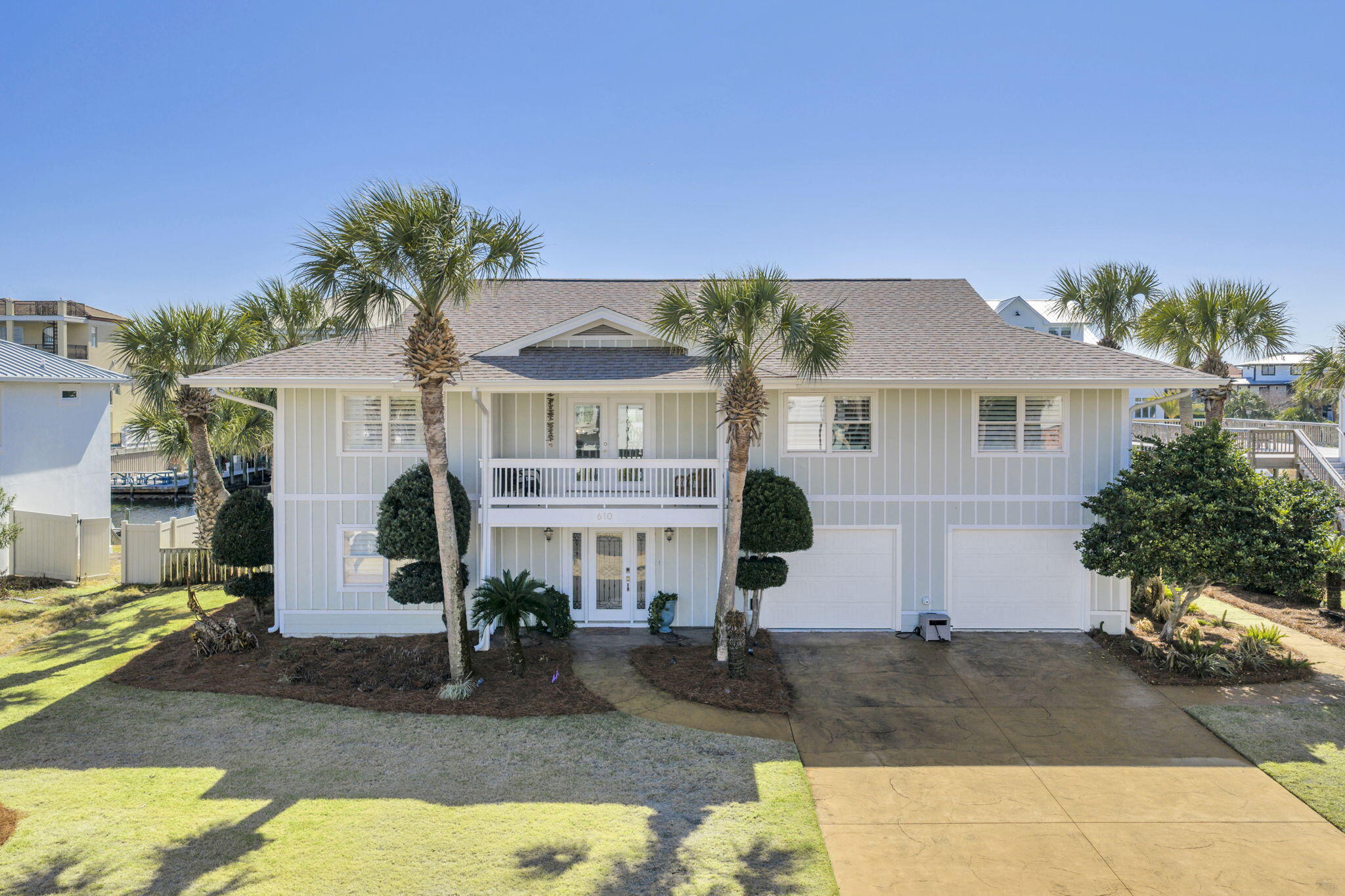 Experience the ultimate in coastal luxury living in this exceptional 3,000 sq. ft.. waterfront residence located in the prestigious Holiday Isle community of Destin, Florida. Perfectly positioned on a tranquil canal just three blocks from the sugar-white sands of the Gulf,  this property truly offers the best of both worlds — beach and boating.
Boating enthusiasts will appreciate the impressive private dock, accommodating up to a 70-foot vessel or configured as two slips with a 30,000-lb lift and a 15,000-lb lift — a rare and valuable feature in Holiday Isle.
Featuring four spacious bedrooms and thoughtfully designed indoor-outdoor living on both levels, this home is ideal for entertaining, relaxing, or maximizing rental potential. Each floor offers its own kitchen and living room, creating a flexible layout perfect for multi-generational living or a high-performing investment property.
Expansive outdoor living areas on both levels capture coastal breezes and water views, while the newly added pool provides a private oasis after a day at the beach or out on the water.
Whether you're seeking a primary residence, vacation retreat, or income-producing rental, this canal-front home delivers unmatched versatility, location, and waterfront convenience in one of Destin's most sought-after neighborhoods.