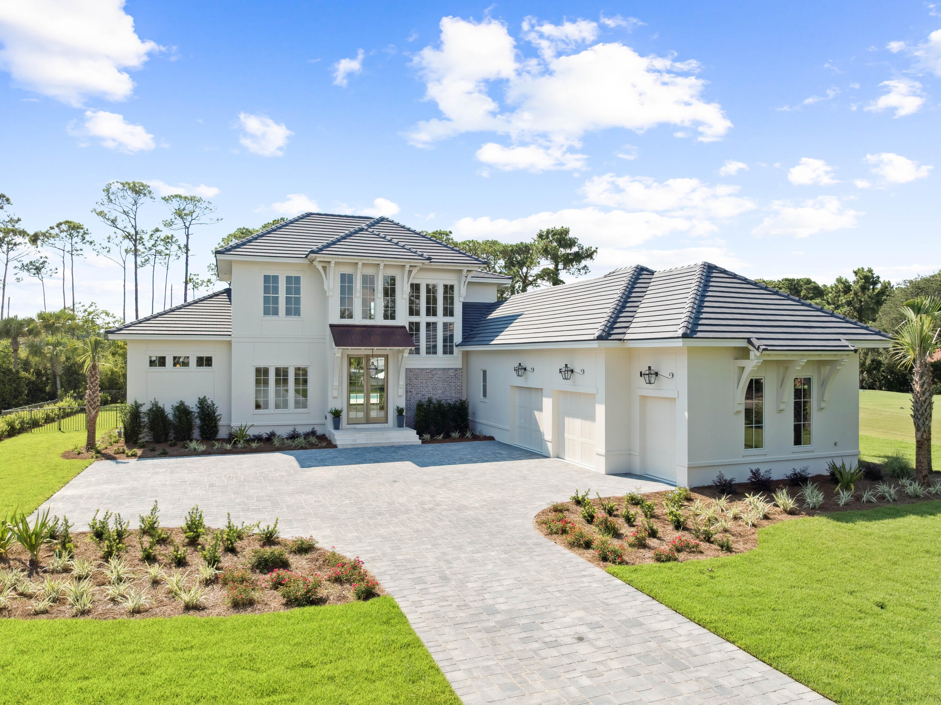 Welcome to the epitome of luxury living with this stunning new construction home, meticulously crafted by Vlahos,
DeBogory and Tuck Construction. Blending modern elegance with thoughtful design, this is your private oasis nestled in Regatta
Bay, one of the most sought-after communities in Destin. 

      As you step inside through the custom Mahogany doors you'll be greeted by an expansive open floor plan, 12 foot ceilings
and oversized sliding doors and windows which allow natural light to fill the space. The gourmet kitchen is a chef's dream equipped with Wolf/Sub-Zero appliances, 2 islands, and custom cabinetry. The master wing of the home provides a lavish space to unwind with a spa-like bathroom and spacious walk-in closet. Enjoy seamless indoor-outdoor living through the 16 foot sliding
glass door showcasing the resort style back yard perfect for entertaining, or relaxing in peace. 

      The second level offers 3 bedrooms, 2 bathrooms and an additional family room equipped with its own kitchenette making
this the perfect spot for games and movie nights.