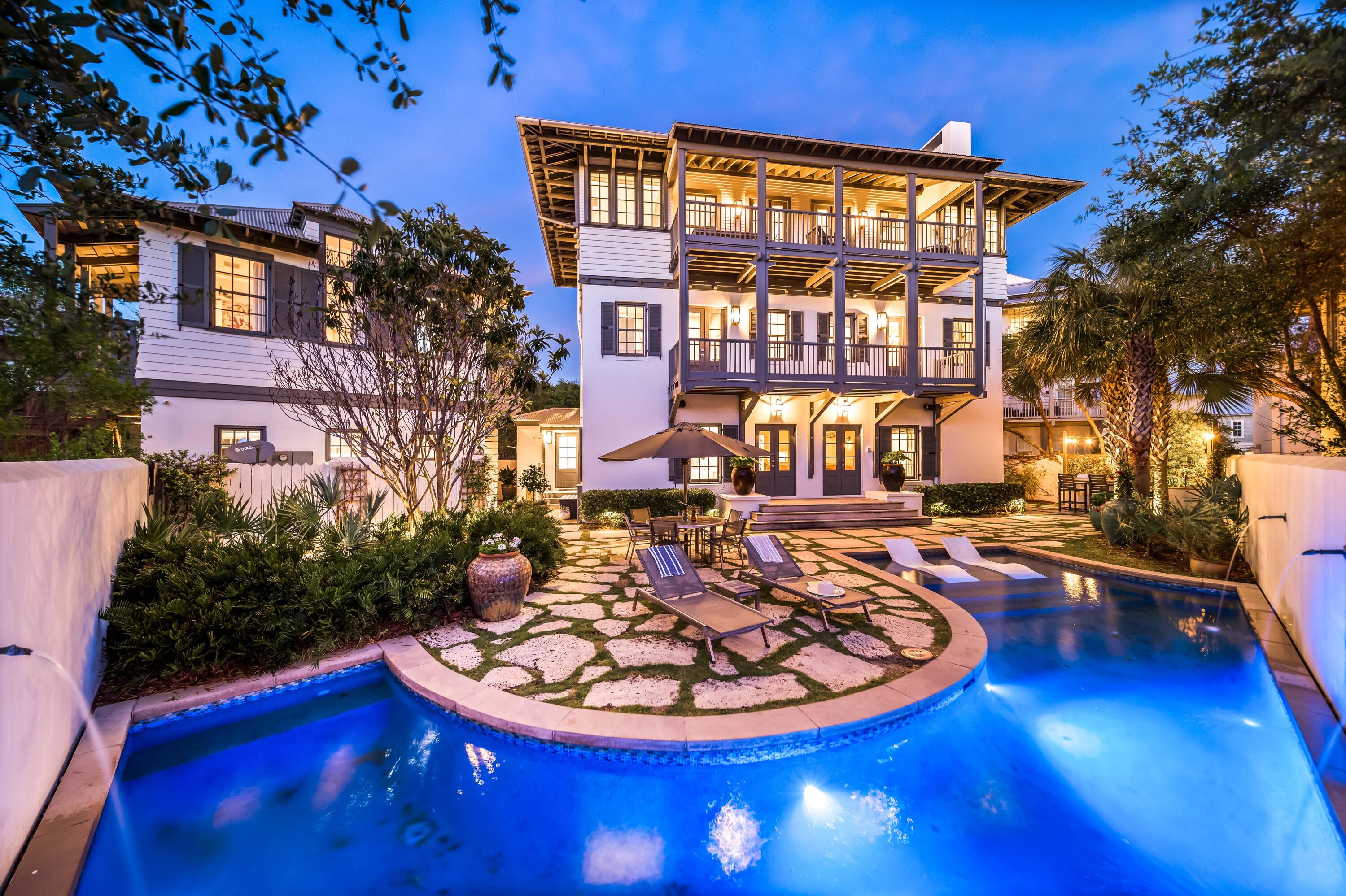 Coastal elegance and modern luxury find their influence throughout this 4,345 sq.ft. exceptionally appointed home in idyllic Rosemary Beach. This private retreat sits on a large 5,300 sq.ft. lot and is characterized by effortless coastal style exceptionally designed by Eric Watson. Curated selections from Tracery Interiors create a unique continuity throughout the home which showcases a mix of natural stone and hardwood floorings, Venetian plaster and pecky cypress walls, exposed beam ceilings, and modern luxe elements in both the Gulf view kitchen and renovated outdoor spaces. The front elevation of the home is anchored by a stone cast entry wall covered with lush greenery creating an inviting welcome to the space. Upon entering the home you enjoy a surprising mix of modern and READ MORE traditional materials enjoyed throughout the home. Two private Guest Suites sit on opposite wings of the first level and offer direct access to the stunning and spacious courtyard. Though this home is sophisticated, there is plenty of space for kids to enjoy, starting with the first-floor lounge and media room with built-in wet bar. Step through the double French doors of the lounge room and you are welcomed into a private resort-inspired courtyard oasis. The centerpiece of which is the sparkling salt-water pool with sun shelf and relaxing water feature, which is flanked by Dominican shell stone and limestone pavers with abundant outdoor seating, lush tropical greenery, and a fully outfitted summer kitchen. An outdoor chef's dream, the summer kitchen features a Lynx grill, an ice maker and refrigerator, marble countertops, and warming over. This outdoor space is the perfect place to land after a day spent enjoying the emerald waters of the Gulf of Mexico that is just steps from your backdoor. Once back inside the home, take the full-sized elevator to the gourmet kitchen on the third floor. This professional kitchen provides timeless conveniences with modern style, fully adorned with a built-in six-burner Wolf range, double Thermador ovens, a new Wolf refrigerator, a new Bosch dishwasher, and stunning marble countertops. The abundant open living space beyond the kitchen, anchored by a custom tufted banquette looking out over the Gulf, invites family and friends alike to gather under the vaulted, beamed ceilings while cozying up to the limestone fireplace, or enjoying a sunset cocktail out on the oversized balcony. 

The beauty of this home extends outside as guests are invited to take in the stunning Gulf views from virtually any space on this level, and four separate covered balconies, all with Ipe decking, allow one to enjoy the late afternoon breeze drifting in off the emerald Gulf waters. The second-level Master Suite is adorned with luxurious fabrics, Venetian plaster walls, a limestone fireplace, and a lavish en-suite bath with double railhead shower and BainUltra hydro-therapy free-standing tub. A secondary kid's space is also found on the second level featuring a picturesque bunk room complete with separate media room and "gamer's" paradise; in fact, each space in the home can be controlled via the state-of-the-art Savant electronics system. 

The attention to detail and modern design elements continues from the Main Home across the courtyard into the Carriage Home, highlighted by natural hardwood flooring, modern coastal cabinetry, and private bedrooms. Guests of the Carriage Home can enjoy coffee each morning with a Gulf view. Located directly on beach Boardwalk A, this home's position takes advantage of incredible privacy, and grand vistas of beautiful sunrises and sunsets, offering the ideal family beach retreat. 

Over $500,000 in annual rental revenue make this property a prime investment opportunity. The combination of natural and modern elements, paired with unparalleled Gulf views, creates a unique, luxurious ambiance found in no other Rosemary Beach real estate offering. 262 Rosemary Avenue epitomizes 30A luxury living and offers a truly unprecedented lifestyle with close proximity to the beach and all of the world-class shopping dining and entertainment that South Walton has to offer.