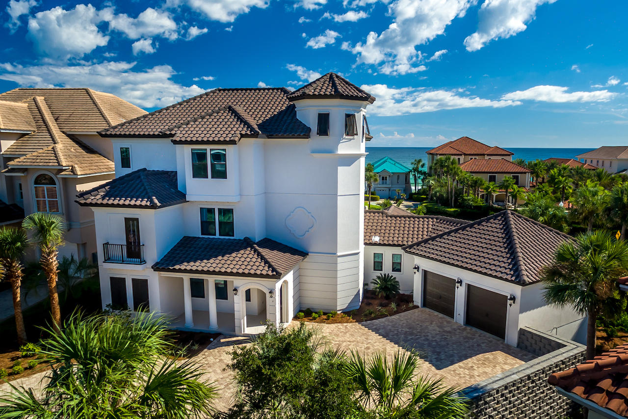 Deeded beach access is located less than twenty steps from this fabulous newly constructed beach home's front gate. Short term seller financing available on this home. You can't get any closer to gulf front living, without a gulf front price than 2 St. Bart's Bay in Destiny East. Positioned perfectly on a wide corner lot, this home provides over 130' of frontage toward the gulf. Corridor gulf views will remain after completion of the gulf front home across the street. A full sized entertainment heated pool, spacious hot tub, and extensive hardscape provide a cool retreat from the sugar white beach. With nearly 5400 square feet of heated and cooled space in three stories plus a two-car garage, this southern influenced transitional style home is both an owner's dream and a rental mac The lucky owner of this fine home will enjoy more than $210,000 in 2017 rental income. Eight spacious bedrooms, all with private baths, a private office, multiple living spaces and an open chef's kitchen ensure enough space and privacy for large gatherings. The soft colored, professional decor, included in the sale, is beach chic and stylish yet relaxing. Painted cabinetry accentuates quartz counters and hardwood floors. An elevator is included for ease of access to all three floors. Destiny East is a prestigious, gated community in East Destin and includes a community swimming pool, an expansive workout facility, a children's playground, community clubhouse with movie theater, two tennis courts, grilling area, nighttime security and a full time facility director to plan events for residents. Please call for your private showing.