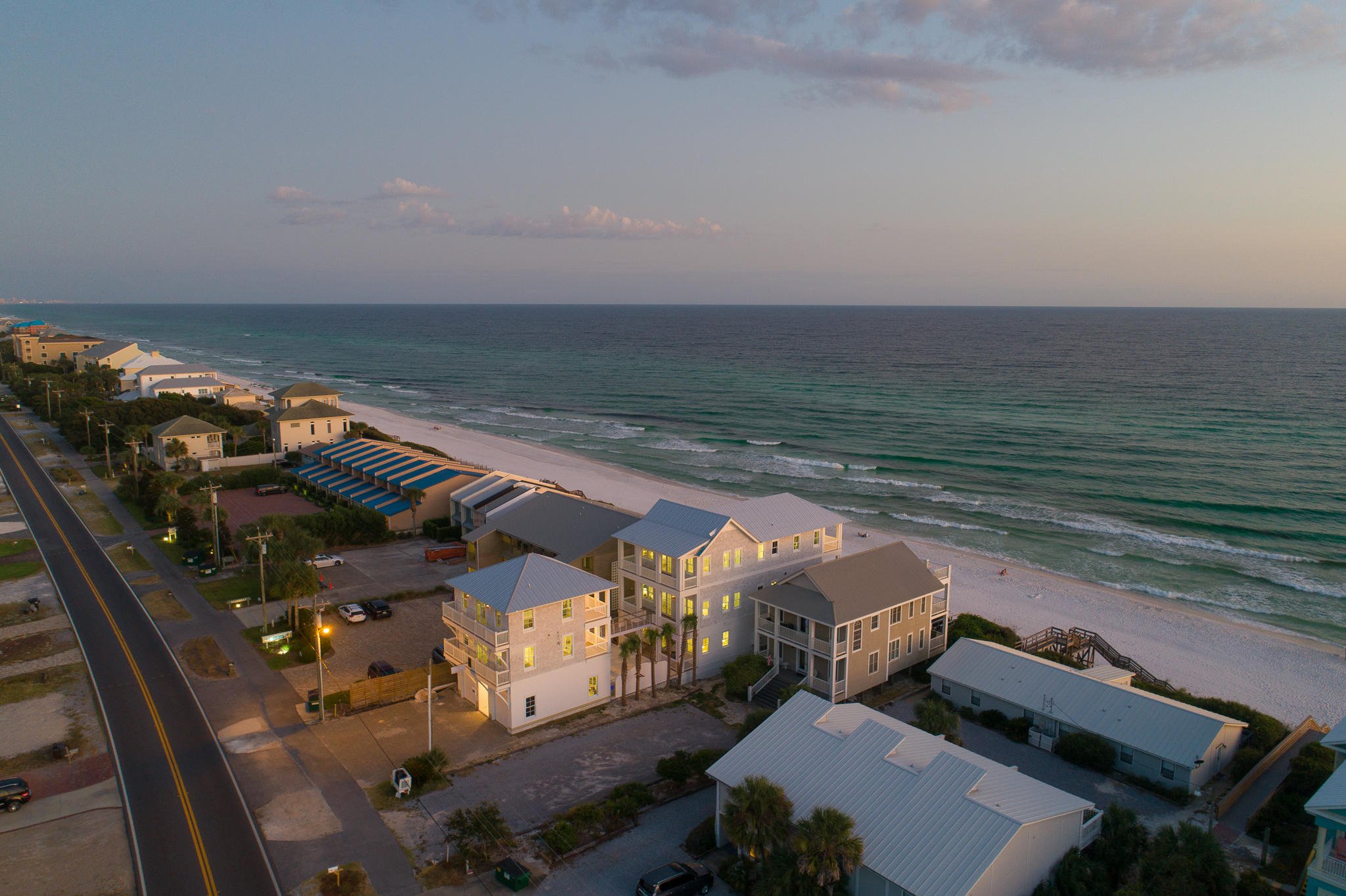 Create a legacy unlike any other where your family can enjoy an unparalleled lifestyle for years to come. Envision an estate where many generations can cherish daily panoramic sunsets & sunsets, beach days filled with sunshine just steps from your front door and a place to relish in the simple pleasures of life. This stunning 30A Gulf-front three-level residence, with a gorgeous main house, guest house, and 2-car garage is the perfect tribute to your family. The property boasts morning sunrises and evening sunsets off the expansive porches affording outdoor living as it was meant to be and is wonderfully suited for entertaining guests or relaxing in the heated pool in the courtyard surrounded by stunning privacy landscaping. Showcasing over $600K in rental income potential, this estate offers the perfect opportunity for a second home, investment property or primary residence.