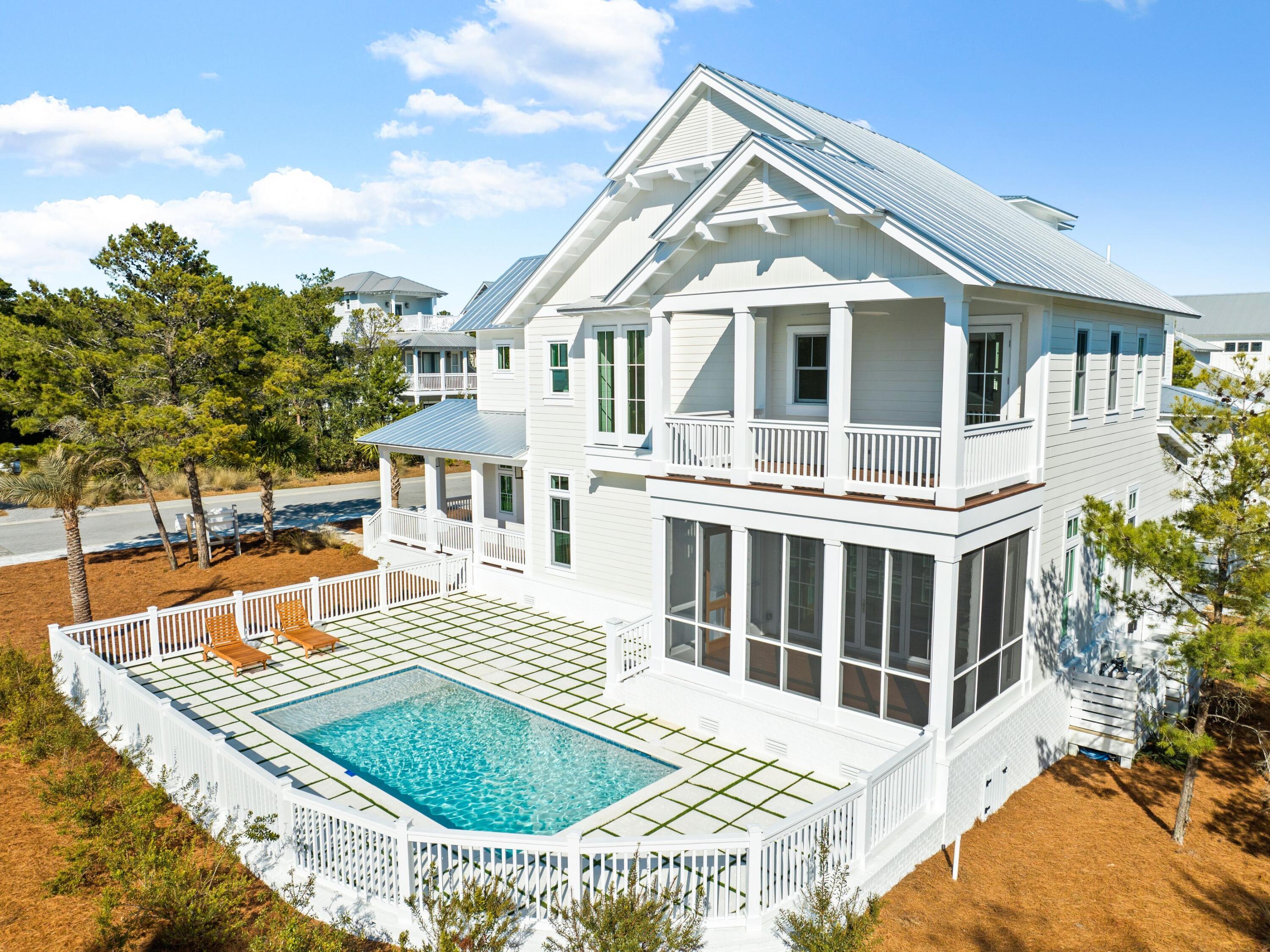 Set within the exclusive Preserve at Grayton Beach, this newly constructed home offers luxury, privacy and thoughtful design at every turn. Situated on the best lot in the neighborhood, this exceptional residence is one of the few to feature a private pool, providing the perfect retreat for relaxation and entertaining. The open-concept layout is accentuated by stunning accordion doors that seamlessly merge indoor and outdoor living spaces, leading to a screened patio with a cozy fireplace.  
Every detail of this home has been meticulously crafted, from the mahogany front and porch doors to the hidden powder room door that adds a touch of whimsy to the sophisticated design. Inside, rich wood floors complement the quartz countertops and top-of-the-line lighting, creating an inviting and elegant atmosphere. The gourmet kitchen is a chef's dream, complete with a gas range, stainless steel hood and wine fridge, making it ideal for hosting and everyday living. Automatic stair lighting adds both functionality and ambiance, while the luxurious primary suite boasts a spa-like bath with a two-person shower.  

This rare gem also includes a garage, a coveted feature in the neighborhood. The Preserve at Grayton Beach offers an array of amenities, including private deeded beach access, a scenic boardwalk with breathtaking views of the dunes and Gulf of Mexico, pickleball and tennis courts, two community pools, a gym, and nature trails. Whether you're seeking a forever home, a second home or an investment property, this must-see residence delivers coastal living at its finest.