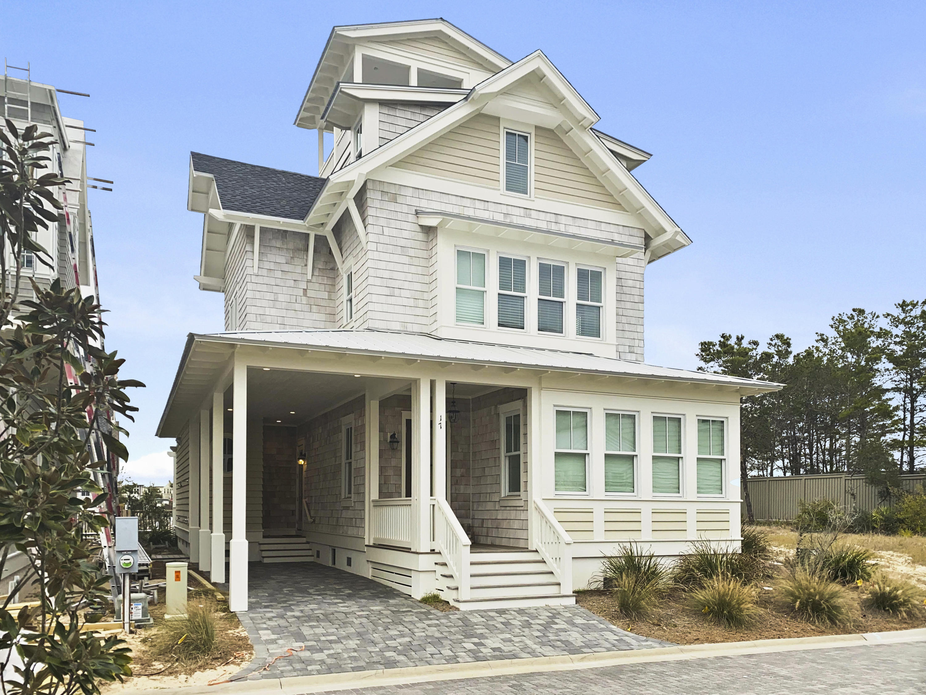 Designed by well-known architect Chris Stoyles of Archiscapes, and impeccably decorated, this 6 bedroom, 5-1/2 bath home offers grand living in the magnificent setting of Grace Point on 30A.Boasting a balanced blend of coastal chic, wood tones, and select fabrics and textures, the layout and flow of the home are both welcoming and timeless for friends and family to enjoy. Upon entry to the residence, the overhead hand-hewn beams will captivate your attention, as you step onto the warm hardwood flooring your eye is drawn to the shiplap & tile clad fireplace creating a dramatic and cozy statement. The gracious great room offers seating for family gatherings and entertaining and the outdoor living becomes seamless with large doors opening to the wide screened in porch. Surrounding the large center island, Subzero and Wolf appliance packages offer the perfect complement for a holiday feast or neighborhood get-together. The kitchen is topped off with tall custom cabinets offering ample storage and stunning Quartz countertops.Each bedroom offers a retreat from your long days at the beach with spa-like baths for refreshing the body and soul while surrounded by Carrera marble countertops and tile backsplashes.  Notable features of the home include: bunkroom, secondary family room, laundry room, oversized porches with a large swinging bed, outdoor seating, and a 4th floor tower to watch the sunrise or sunset over the Gulf of Mexico.Life at Grace Point provides owners with an opportunity for a Lifestyle Membership to Clubs by Joe. Simply step off the front porch and walk thru the manicured park to the private gated access to WaterSound Beach Club and the Coastal Dune walkovers to the pristine private beaches, or head over to Camp Creek and Sharks Tooth for a day on the Links. Later that evening, bike or walk along the pedestrian path to the HUB on 30A for shopping, food, live entertainment and endless family fun.