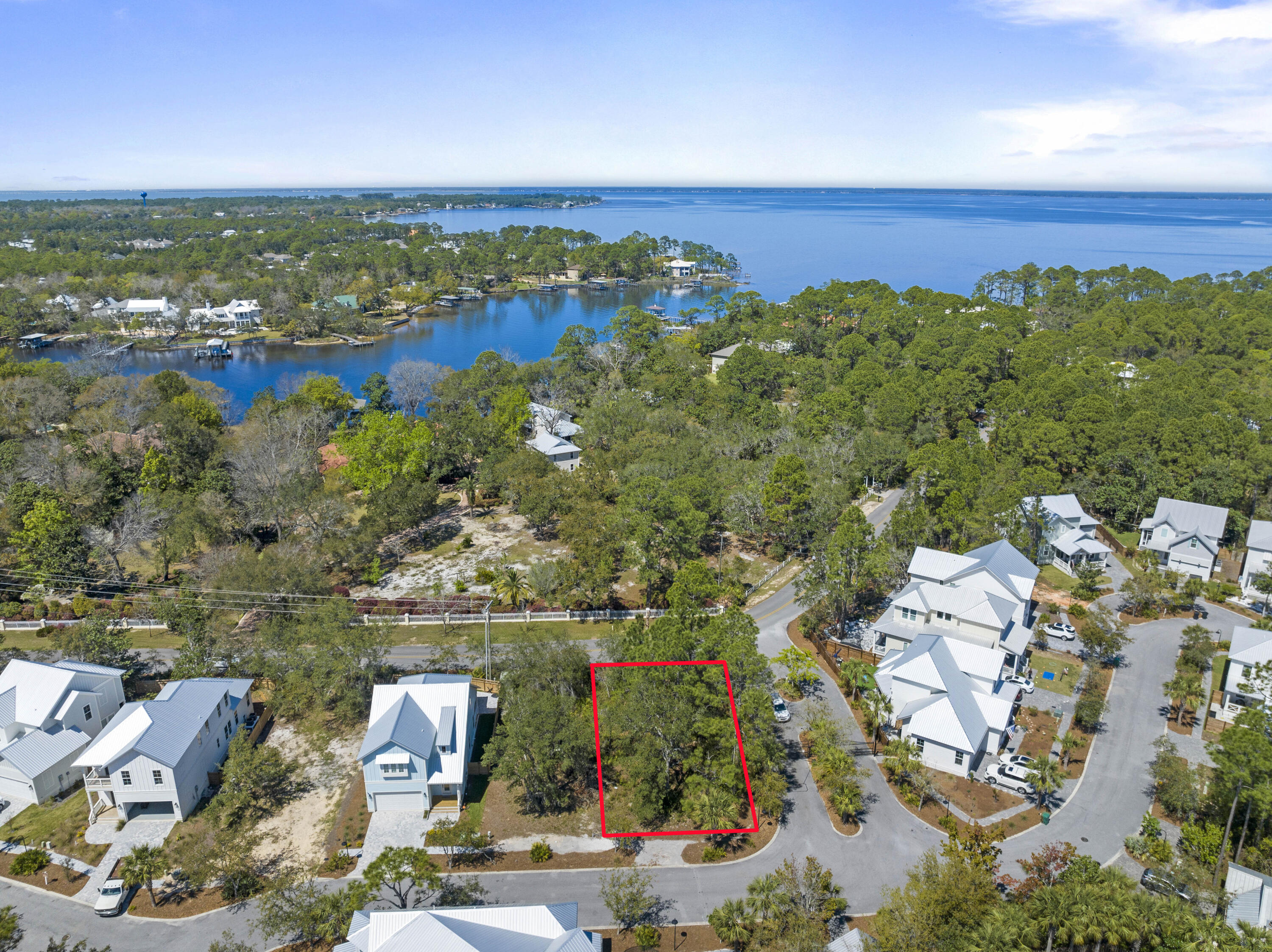 Great flat, buildable lot located in the lovely gated community of Hidden Grove. Bordered by Point Washington State Forest and featuring a charming community pool and Florida Cottage style construction, this quaint little hidden gem of a neighborhood is great for full time living with quick access to many nearby shops, restaurants as well as the beautiful beach of South Walton on 30a!  You'll appreciate  being so close to everyday conveniences such as Publix, Grand Boulevard Shopping Center, Sandestin Resort, Silver Sands Outlet Malls, Walmart, Sacred Heart Hospital and so much more.