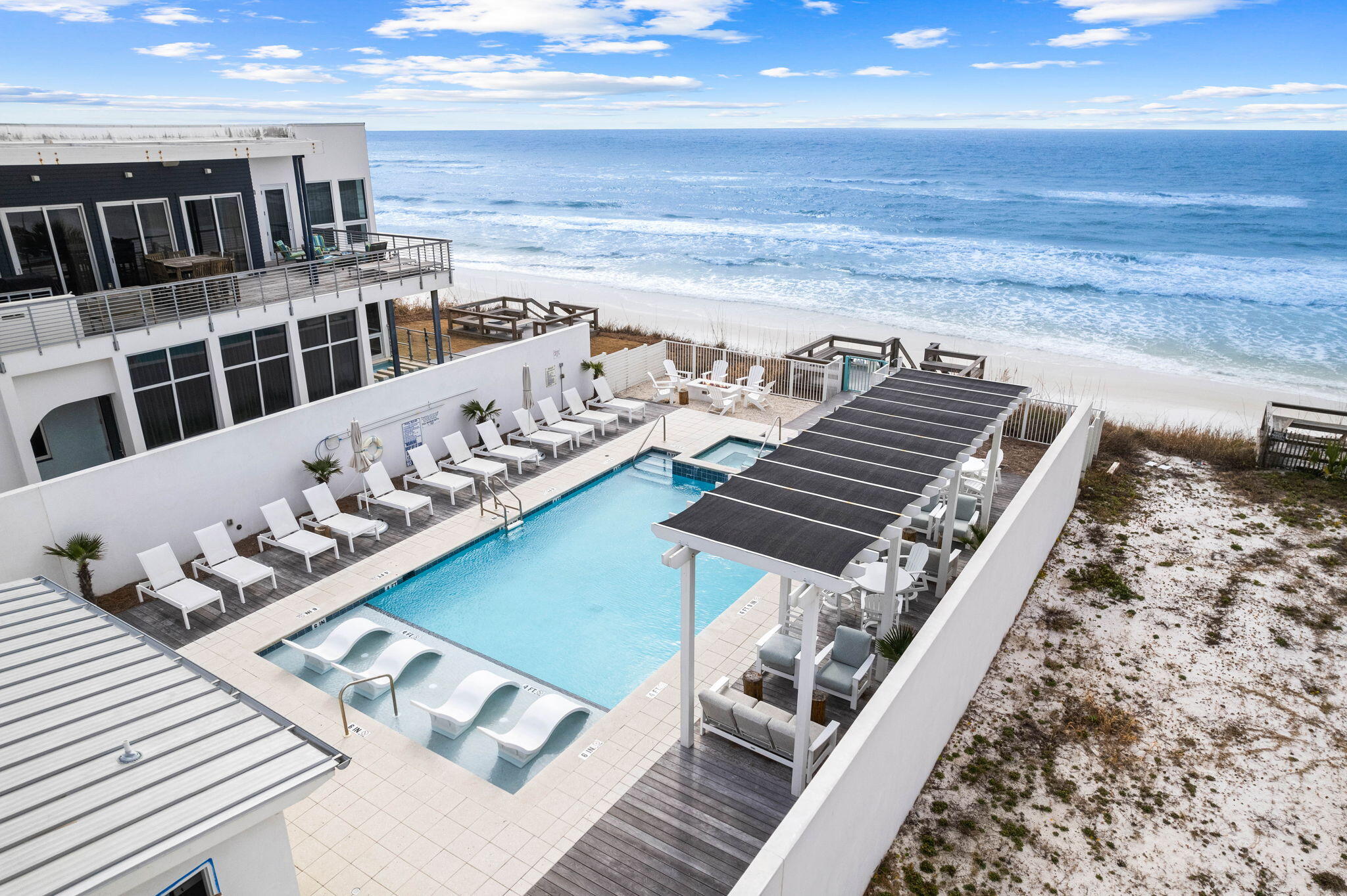 Designed with a captivating and pristine aesthetic, this beach haven offers breathtaking Gulf views and the Gulf Front Pool adds to the allure. This residence boasts an expansive and welcoming living space, complemented by a generous balcony overlooking both 30A and the Gulf. Featuring 4 spacious bedrooms, 3 of which are equipped with its private bathroom along with one half bath. The 4th bedroom was converted into a bunk room for additional sleeping. This coastal retreat is adorned with a full-sized laundry room, light and bright interior and an expansive balcony to enjoy the Gulf views and warm breeze. 
Ownership of a Viridian Condo comes with exclusive access to a private beach, a shared green space on the Gulfside, and reserved parking spaces. Centrally located, it allows easy walking or biking access to shopping, dining, and special events, making it an ideal coastal escape.  The upscale Surfing Deer restaurant is located downstairs and is known to have some of the finest cuisine on 30A.  

This residence is being sold furnished, only excluding the linens.  The building is only 4 floors and an elevator is available.  Don't miss this rare opportunity to own a stunning property on 30A with substantial short term rental history which makes it a great investment!