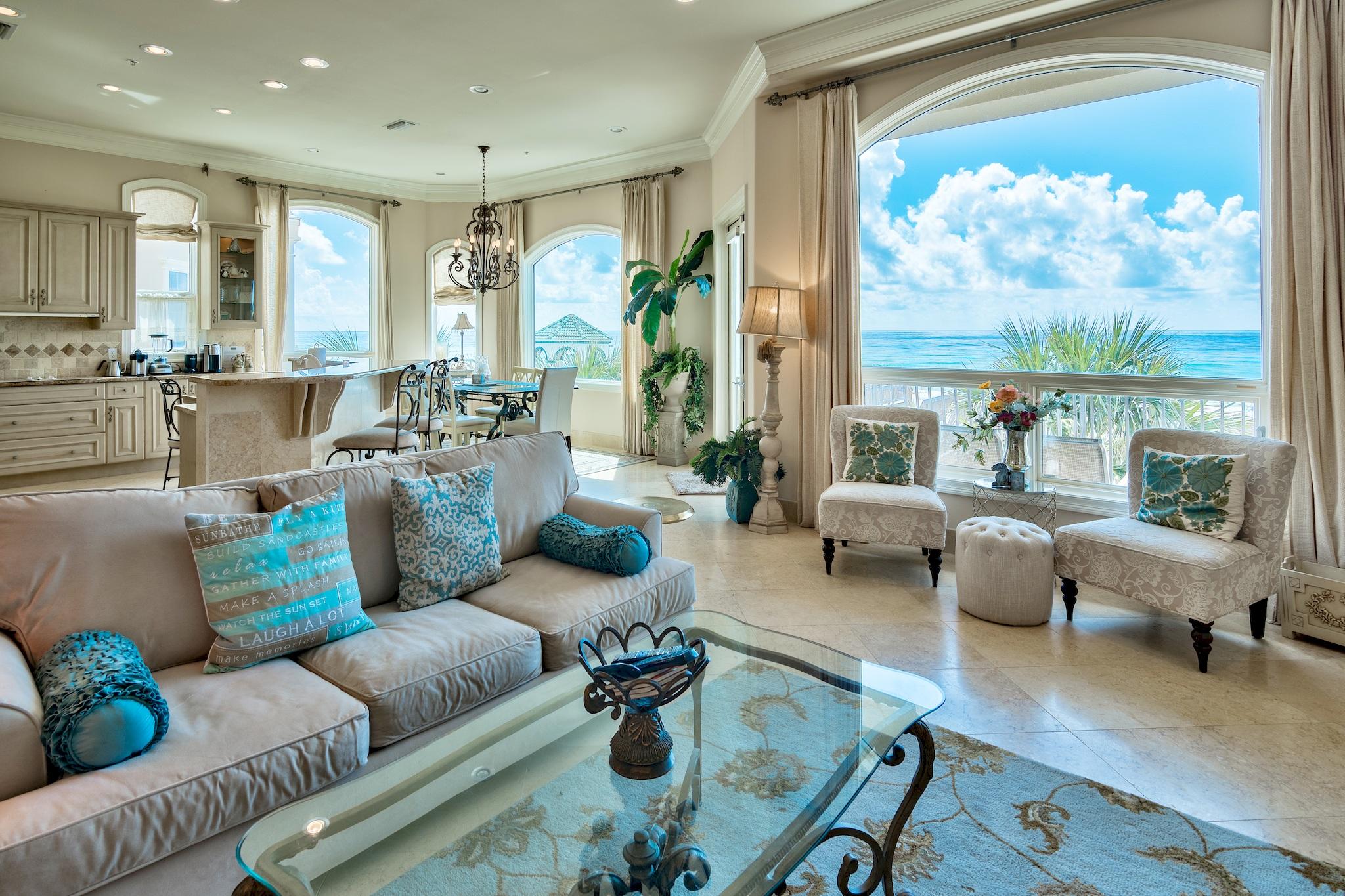 Impressive 4-Story Mediterranean-Inspired Beach Home with Plunge Pool, Private Beach Access, and In-Home Elevator in Gated Dunes of Destin. This vacation rental exceeded $180K in 2019. With updates, it's projected to top $250K in annual income! At the home's entry, a wrought iron gate leads to a private courtyard with private plunge pool. Tall palm trees and stucco wall, lining one side of the pool, provide privacy. Inside, an array of oversized arched windows and balconies carefully highlight the incredible views for a staggering, jaw-dropping sensory experience. Mediterranean architectural elements like sweeping arches, a tile roof, and wrought iron accents are timeless and elegant. This home provides ample gathering spaces and conveniences.  
In addition to the main living living/kitchen on the 2nd floor, the 1st floor and 4th floor both contain a living area and tiki kitchen, one with a full-size refrigerator. A media room provides extra entertaining space. The main kitchen is designed for entertaining a crowd with 2 dishwashers, a double oven and plenty of workspace. Designer appointments include granite counters, a paneled refrigerator, and ornate cabinetry. Mornings are cheerful, and evenings are restful in the luxurious master suite with cozy sitting area with fireplace, private beachfront balcony, morning kitchen, and deluxe en suite with spa tub. Dunes of Destin is an exclusive, gated community featuring private beach access, a community pool, and a stunning lake with beautiful fountains and gazebos. Located in the heart of Destin, Dunes of Destin is close to shopping, dining and area attractions.