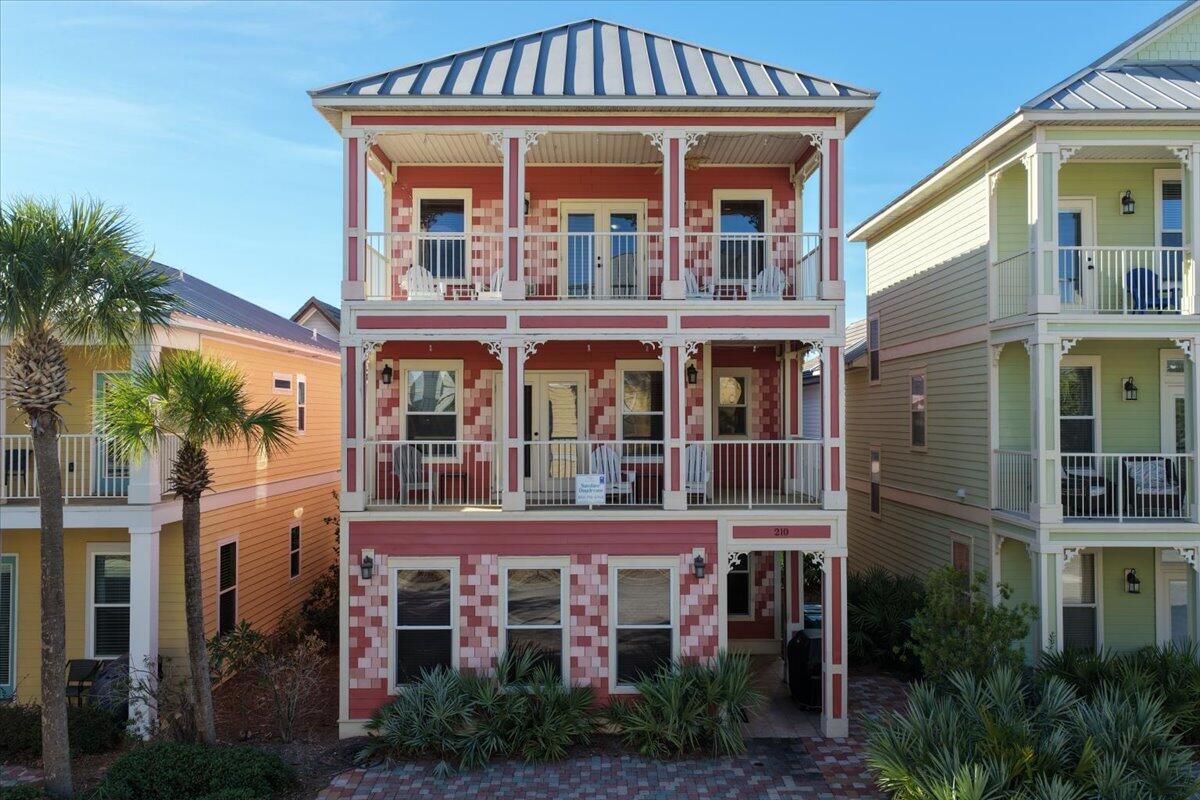 Located in the highly sought-after Villages of Crystal Beach, this premier gated community is a favorite among investors thanks to its strong rental performance. This impressive 5-bedroom, 4-bath, three-story retreat offers 2,769 sq ft of spacious, comfortable living—fully furnished, turn-key, and rental-ready.
The open-concept layout provides plenty of room for large groups, while the expansive third-floor sitting area with its own balcony access creates an ideal hangout space for guests. From both covered balconies, enjoy beautiful views of the resort-style lagoon pool.
The community's incredible pool area features waterfalls, a tropical island, a beach-entry design, a hot tub, and a tiki bar/grill—perfect for relaxing days close to home. And when you're ready for the beach.