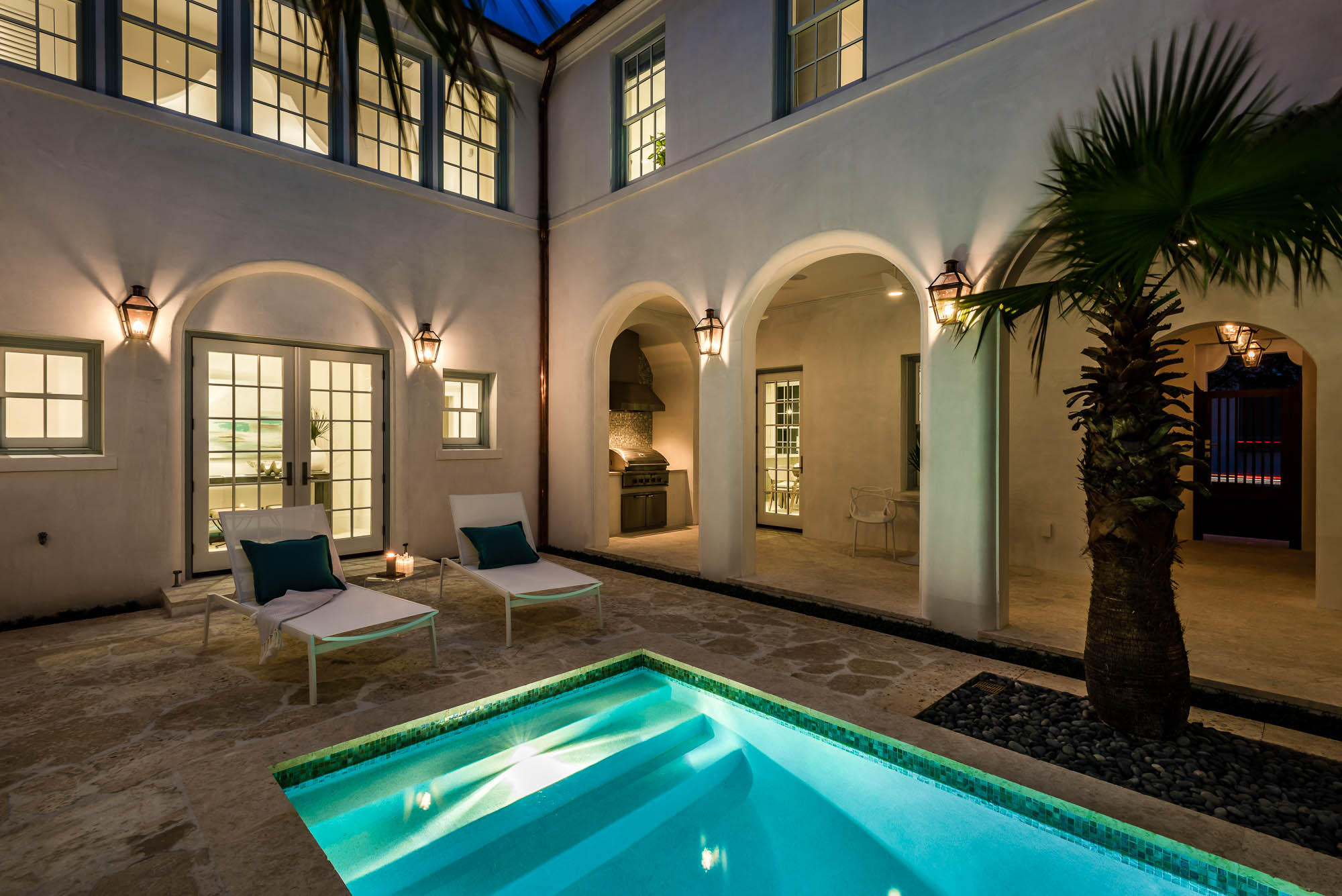 Historical Concepts designed this Alys Beach home with a discerning owner in mind. An inviting Zaguan entrance from North Charles Street ushers one to the large courtyard, complete with a private pool, summer kitchen and shaded loggia. Venetian plaster enhances the open floor plan of the kitchen, dining and living room with fireplace. The kitchen boasts Wolf/Subzero appliances, accent tile, Caesarstone countertops and a generous waterfall edge island with storage. The butler's pantry houses a Subzero wine cooler, Miele coffee maker, microwave, warming drawer and storage. Off the kitchen is a mud/laundry room, complete with beach lockers. A Guest Master suite is conveniently located on the first floor overlooking the courtyard. Home is being sold fully furnished. This bedroom includes a vaulted beamed ceiling and bathroom with a double sink vanity.

The second floor Master overlooks the courtyard below with ample closet space, a spa inspired master bath, with Kohler soaking tub, Hansgrohe fitted shower, shellstone countertops & tile. Two guest rooms, each with private bathrooms share the second floor and are enhanced by a family/den area. Interior furnishings have been appointed by Urban Grace Interiors.