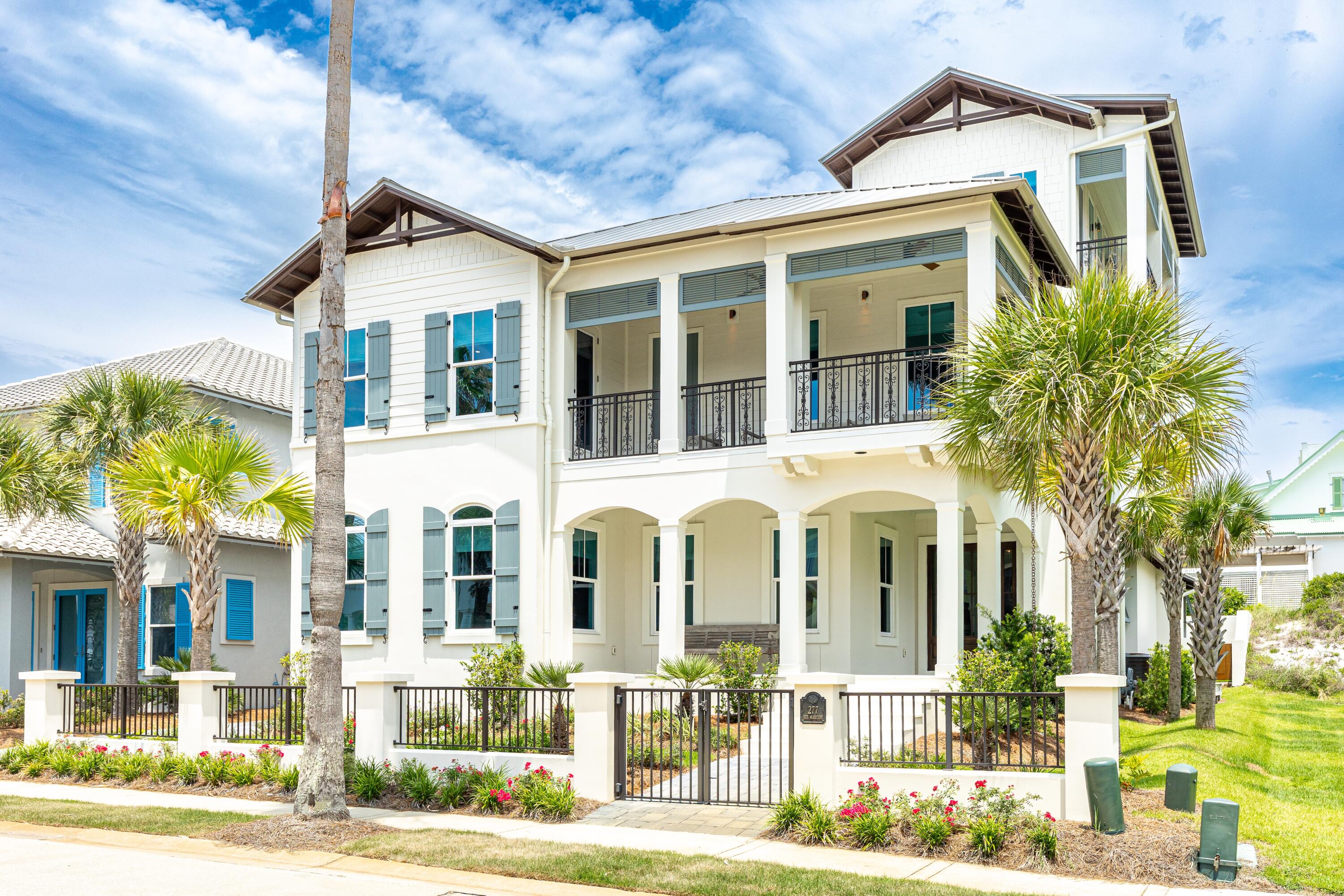 Your Caribbean-Inspired Oasis Awaits in Guard-Gated Caribe!

In less than two minutes, you could be unwinding on Caribe's quiet, sugar-white beaches—your beach chair already set up, the waves just steps away. Nestled just 400 feet from 500 feet of neighborhood shoreline, this 2022-built coastal retreat was thoughtfully designed by DC Architects and masterfully constructed by Dennis Childers.

Step through welcoming glass front doors into interiors curated by Julie Liebetreu, where neutral tones, plush designer furnishings (included in the sale), and layered textures create an atmosphere of refined comfort. Stone tile flooring soothes underfoot, while interior brick accents, exposed wood beams, and statement lighting offer understated luxury. The open-concept first floor is perfect for gatherings or quiet evenings by the gas fireplace. A chef's dream, the kitchen features custom floor-to-ceiling cabinetry, a large pantry, copper-accented hood, Viking range with griddle, Sub-Zero appliances, and even a crushed ice maker for ultimate refreshment. A central island offers storage, a microwave drawer, and seating for four.

Downstairs also boasts a sumptuous primary suite, complete with serene linens, muted rugs, and wood accents. The ensuite bath includes a soaking tub, dual vanities, and floor-to-ceiling tile. French doors lead to a private, walled backyard with astroturf for easy maintenance and a fully equipped outdoor kitchenideal for al fresco dining with a 6-burner grill, vent hood, sink, and refrigeration.

Upstairs, guests will find three spacious bedroomsone ensuite and two sharing a Jack-and-Jill bathall tied together with soothing blues, wood floors, and access to a balcony with Gulf views. A five-seat home theater sets the scene for cozy movie nights.

Ascend to the third floorby stairs or elevatorfor a sunset-viewing lounge with panoramic Gulf views and an outdoor balcony, perfect for evening cocktails.

This home also includes a rear-entry 2-car garage, plus a full-house  generator, a spacious laundry room, and powder room with stunning tile accents.

Located in Caribe, a gated gulf-front community in Miramar Beach, residents enjoy access to two community pools, tennis courts, and over 500 feet of private beach. Short-term rentals are permitted with restrictions, making this a rare opportunity for both serene living and investment potential.
Come home to tranquility, style, and sand-between-your-toes simplicity. Welcome to Caribe.