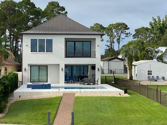 Very nice custom bayfront home built by highly respected DKM Builders. Beautiful unobstructed bay views on private dead end street and just seconds from everything. Master on the main. All 4 bedrooms are large enough to accommodate king size beds. Upstairs living room can easily be converted to a 5th bedroom. Impact doors and windows through out.  New A/C units inside & outside. Home has tons of extras and is a must see.

Lot 4 with detached garage, basketball court and bonfire pit is NOT included in sale and will be separated at closing.  Lot may be purchased for an additional $800,000 with and ONLY with the purchase of home.  

Please allow 24 hours to schedule showings.  All dimensions to be verified