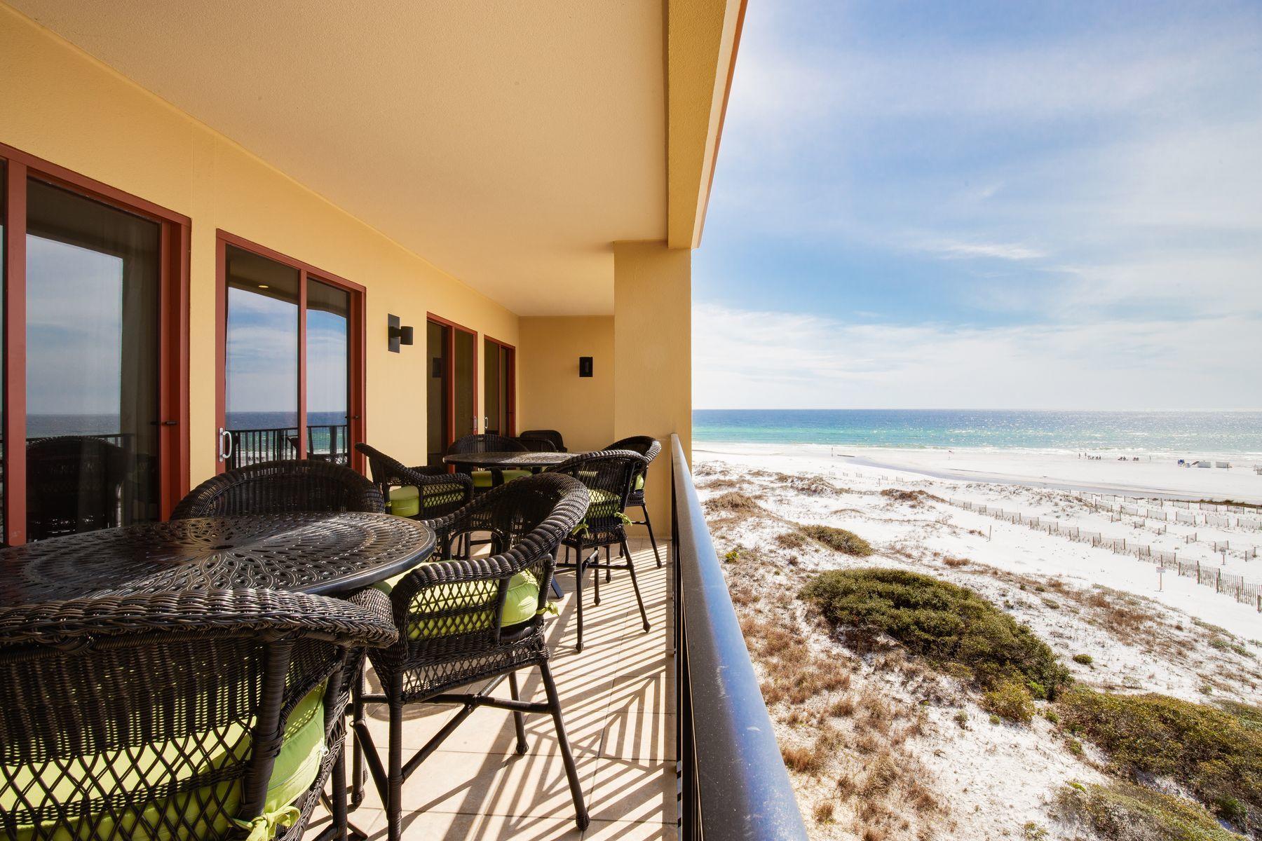 One of the best views in Blue Mountain Beach can be enjoyed from this top floor five-bedroom, four and one half bath condo. The breathtaking setting with panoramic lake, gulf and beach vistas is matched by a residence filled with high-end fixtures, luxury Restoration Hardware furnishings and custom features. From the richly toned travertine flooring to the custom recessed lighting, nothing has been compromised when it comes to quality. Added closets in the foyer and an owner's closet in the southwest bedroom provide extra space while a new larger water heater and upgraded bathroom ventilation ensure the utmost comfort. The large bespoke kitchen is defined by an angled breakfast bar topped with black granite. A full range of Viking appliances includes a double oven and oversized gas stove make entertaining easy, whether it's a laid back brunch or gourmet dinner party in the elegant dining room. Wake up to postcard-pretty views of Big Redfish Lake and start the day in one of several amazing travertine-walled master baths. Guests will be wowed by the media/bunk room compete with recliner chairs, sound bar and DVD/Blue Ray. Step onto the balcony to enjoy the sound of the waves and the gentle sea breeze. It's the perfect spot for enjoying a leisurely breakfast or a peaceful read overlooking the rare coastal dune lake with its birdlife. The soft white sands draw you to enjoy a stroll, or perhaps go fishing. In the evening, sit back in your favorite armchair and savor the stunning views of the sparkling green gulf waters through the living room windows. Socialize with neighbors at one of the community pools, exchange stories with friends around the fire pit, or practice your stroke with the virtual golf simulator.