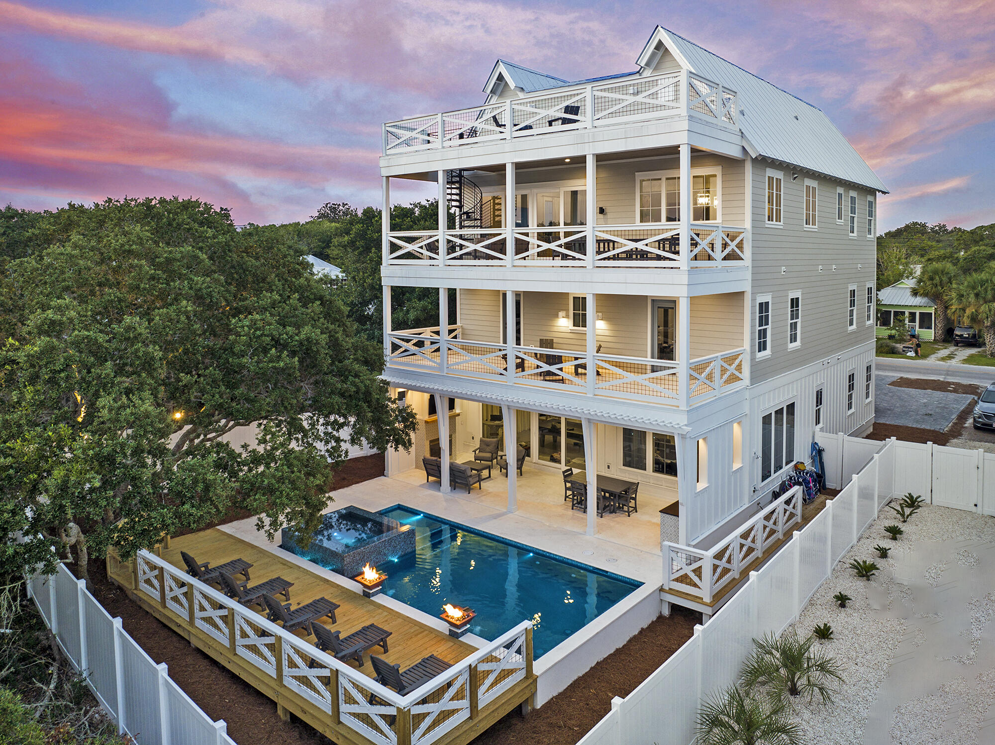 Welcome to Grayton Beach's newest luxury home—512 Defuniak St. Located just steps from the world famous Red Bar, the local favorite Chiringo and the sun kissed shoreline, this home is a dream coastal retreat.  The home is projected to produce $504,800 in rental income, making for an excellent rental investment. Step inside and be greeted by a stunning open floorpan that exudes modern luxury and custom design. Amazing windows throughout flood the home with sunlight and gulf views. 8 bedrooms, each with ensuite bath plus a powder room means you'll always have plenty of room for all of your guests. 

On the ground floor, the game room seamlessly flows into an inviting outdoor kitchen and fireplace lounge area that overlooks the pool and spa—sure to be a focal point of all outdoor festivities. Sit by the fire and watch football while the kids splash in the heated pool! Every aspect of this property was intended to suspend the boundaries between indoor and outdoor living.  Made for entertainment, this bottom level includes a huge wet bar with ice machine, pool table and den. Climb the staircase or take the elevator to one of the three massive upper decks in the evening to capture those amazing 30a sunsets and views of the gulf. 

Superlative craftsmanship is illustrated throughout utilizing premium materials including white oak hardwood floors and designer tile.  The spacious chef's kitchen includes custom cabinetry, GE Monogram appliances and built in full size refrigerator & freezer which would please even the most discerning home chef. This home has been custom-designed to harmoniously blend with the charming old Grayton aesthetic while still providing all the comforts that only new construction can provide. 

Don't miss the chance to own this extraordinary Grayton Beach beauty!