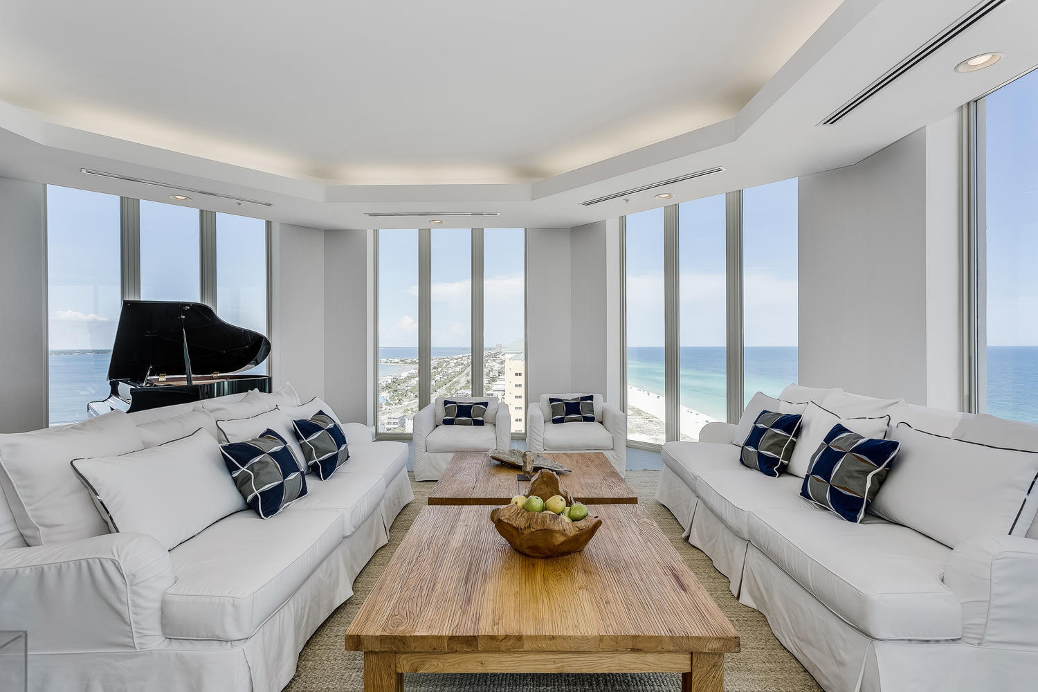 This Beach Club gulf-front sky home offers sweeping views of Pensacola Beach from the beautiful Gulf waters to the Inter-coastal Waterway and the Bay beyond. This four bedroom, four and a half bath home is elegantly furnished and includes a baby grand piano. The balconies are over sized to provide ample outdoor living spaces with views of the Gulf, an eastern view towards Navarre Beach and the back balcony faces northward allowing view of the sound and a westerly view of the beach. The gulf front balcony includes an electric grill and glass railings. Additional features in the condo include floor to ceiling windows with electric solar shades, spacious living area with LED recessed lighting, gourmet kitchen with expansive marble counter space, custom cabinets, a walk-in butler's pantry, and stainless designer appliances. The gulf front master suite includes a spa worthy master bath with a dry sauna, walk-in double shower, round whirlpool tub, and a bidet. Master Bedroom includes large walk-in closets with custom built-ins. Each additional bedroom has a full bath of its own. 1801 sells with two covered parking places! The Beach Club amenity package has something for everyone. Enjoy a massage or treatment at Beach Clubs posh spa, or check out the open fitness center, indoor pool, beach front pool and spa. This is luxury living at it's best!
