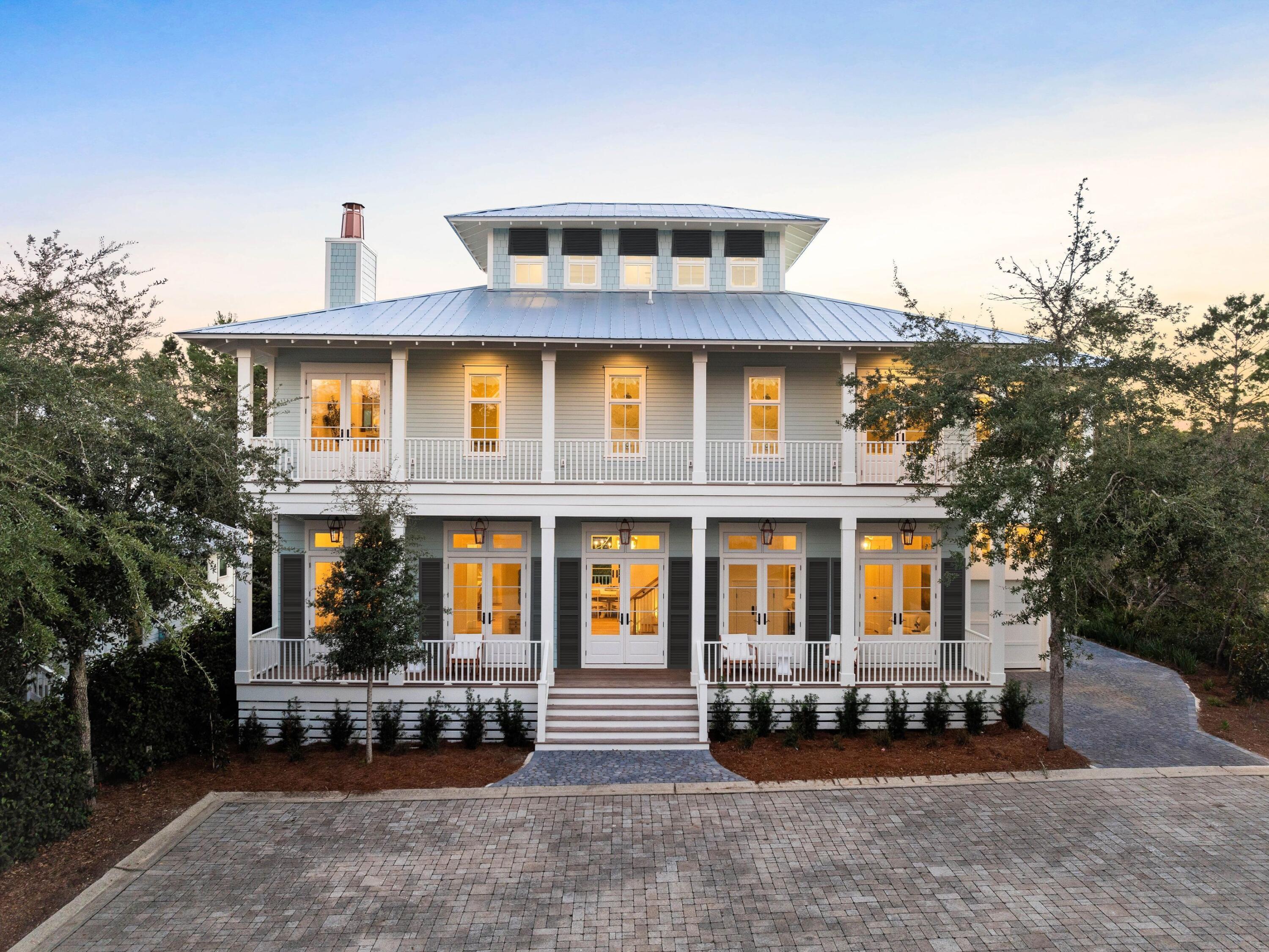 Blending coastal tradition with comfort and luxury, this newly built Traditional Southern home is a masterpiece of traditional design. Carefully crafted with great attention to detail, the home offers 3 bedrooms, 3 full baths, 2 half baths, a bonus room/office, and a reading room downstairs. Long, covered porches on both lower levels and a lookout on the roof add to its charm. A generous entrance hallway incorporates a cozy nook for reading and a staircase leading to bedrooms on the second floor. Carefully blending elegance with modern convenience, this stunning home showcases white oak flooring and plenty of marble, all brought to life with high-end lighting. Professionally furnished, this new construction home oozes character and luxury. The main living room is a seamless flow connecting the defined areas for sitting and dining. Wood flooring emphasizes the generous space available when entertaining. An open fireplace and huge French doors with top transoms add light and warmth to the sitting room, while recessed bookcases provide space to display your favorite books and treasures.

Expansive porches allow for an outdoor Florida lifestyle, with carefully curated gas lanterns adding a glow after dark. The all-white kitchen is an epicurean inspiration with full-height cabinets and a walk-in pantry. Brand-new appliances and a stunning central island with bar chairs add to the appeal. Three bedrooms with immaculate private bathrooms offer private sanctuaries of serene space. Space-saving sliding barn doors are another touch of genius. The master bedroom has doors opening directly onto a private upper terrace, offering a secret retreat for reading and relaxing. 

This home is ideally located near a variety of local amenities, including a community pool, with restaurants and shopping just a short walk away. Greenway Station, a vibrant and walkable hub, offers upscale dining, boutique shopping, and a lively atmosphere right outside your door. You'll also enjoy easy access to scenic walking and biking trails, as well as the region's beautiful beaches, including the iconic white sands of the Gulf of Mexico. Nearby attractions feature state parks and the unique coastal dune lakes of 30A. Whether you're visiting local farmers' markets, enjoying live music, or savoring fresh seafood, this location puts you at the heart of it all. The charming communities of Seaside and Rosemary Beach are also nearby, offering a range of boutique shopping, dining, and entertainment, making Greenway Park a sought-after place to call home.