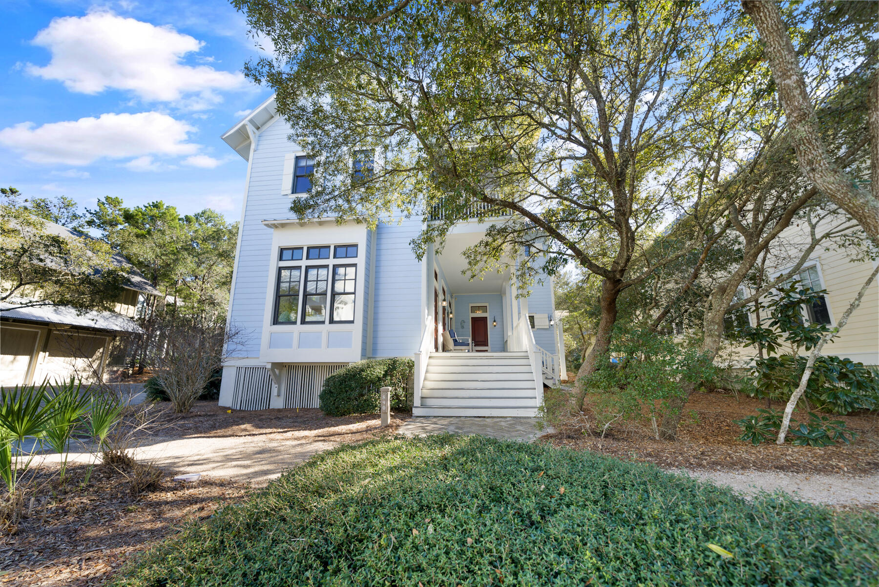 Indulge in coastal bliss with 890 Western Lake Dr., a meticulously remodeled haven tailored for 2024. Nestled in the highly sought-after phase one of Watercolor, this gem sits amidst the allure of tennis courts and convenient Seaside cut-throughs. Step inside to discover a sanctuary adorned with fresh paint, complemented by newer wood paneling, fresh new window treatments, and elegantly refinished floors. No detail is spared in the remodeled bathrooms, offering a retreat-like ambiance. On the first floor, this exceptional home boasts all the amenities you desire, including a fully equipped kitchen, elegant dining area, spacious living room, convenient laundry facilities, and a luxurious master bedroom with its own ensuite bathroom. Embrace the epitome of modern coastal living with an open floor plan that effortlessly blends style and functionality. Ample porch space invites you to bask in Florida's sunshine on both levels, providing the perfect setting for outdoor relaxation and entertaining. Ascend to the second floor to discover three additional bedrooms, each boasting its own ensuite bath, ensuring comfort and privacy for guests and family alike. Nestled behind the main residence lies a separate carriage house, offering independent living with a kitchenette, room, and full bath. Complete with garage parking for your beach car or golf cart, this additional dwelling adds versatility to this exceptional property. 890 Western Lake Dr. epitomizes the quintessential Watercolor lifestyle, offering unparalleled comfort, convenience, and elegance for discerning buyers seeking coastal perfection.