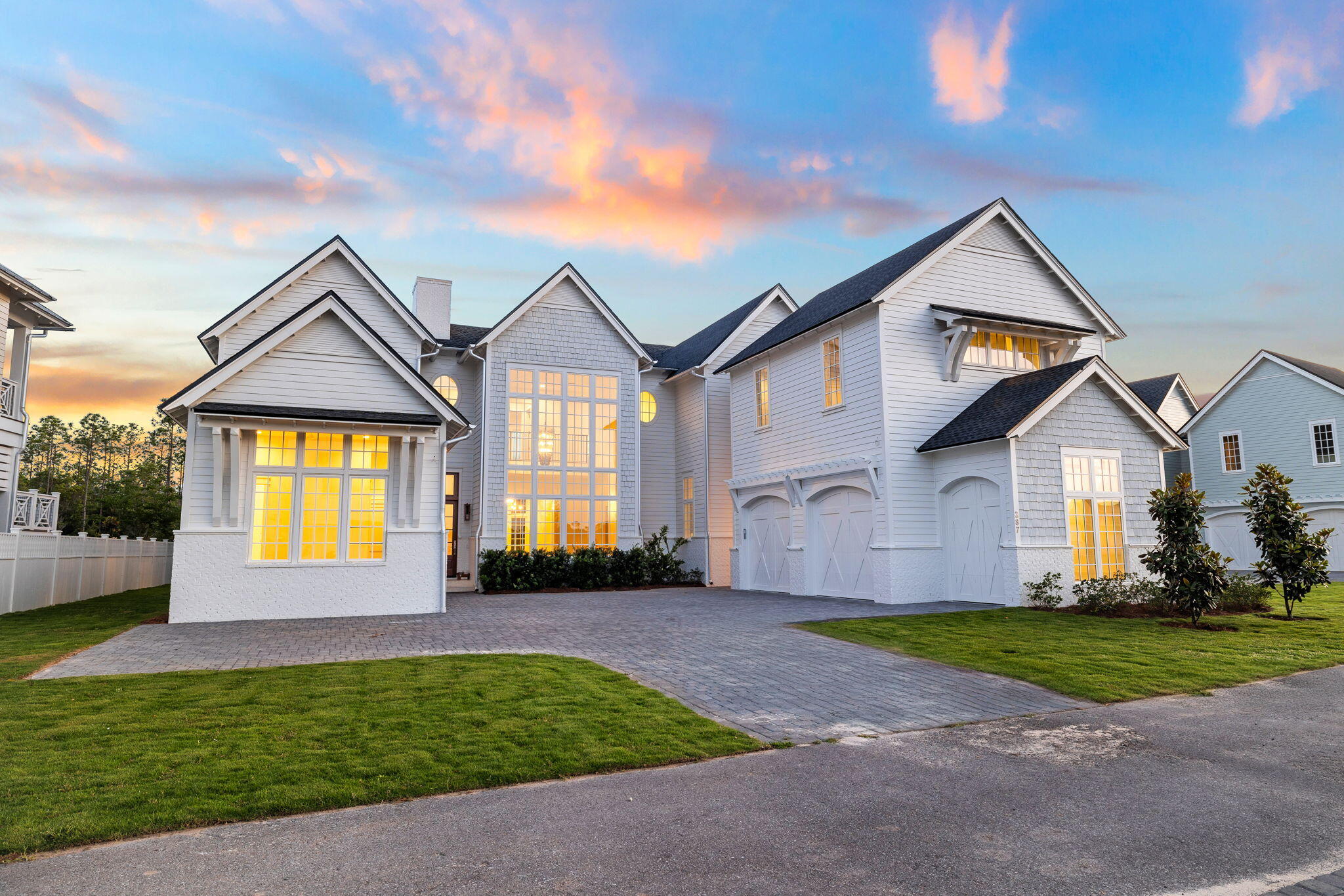 Welcome to your dream home, where the floor plan is designed for the ultimate in entertaining - a true embodiment of Florida living at its finest. This elegant new construction, nestled behind the private gates of Camp Creek, boasts impeccable craftsmanship with a tasteful coastal charm that runs throughout.

The first floor features its very own master suite, complete with his and hers walk-in closets and a pristine master bathroom that exudes spa-like vibes. The spacious, open first floor encompasses a gourmet chef's kitchen, a walk-in butler pantry, a wine room, and a living and dining area united by a cozy fireplace.