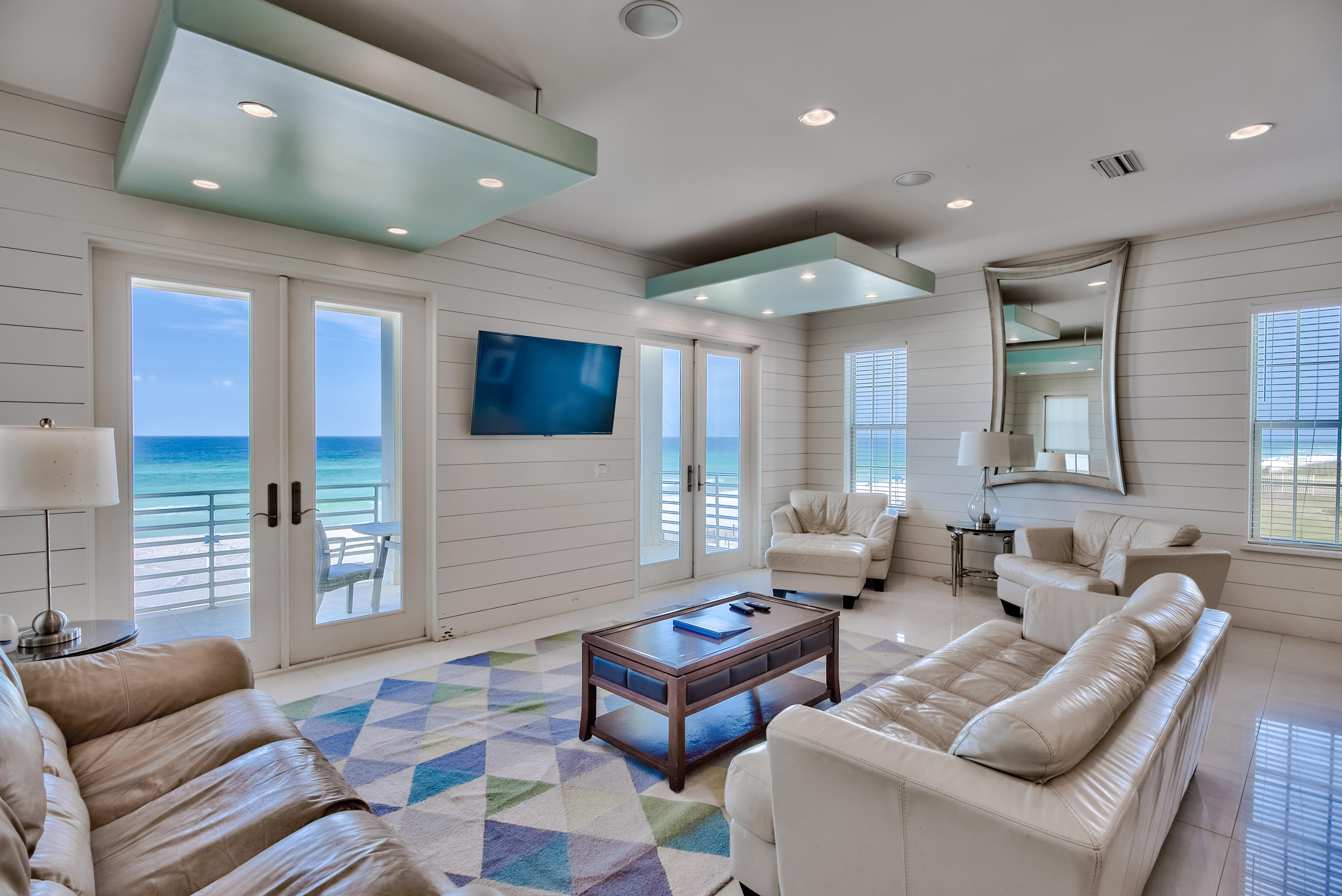 Prime gulf front positioning paired with sweeping western views characterize this beachfront retreat which boasts 7 bedrooms and strong short term rental potential ($240,000 - $295,000 in gross projected annual rental income) primely located in the gated neighborhood of Shipwatch. Masterfully built in 2012, this home was thoughtfully designed with ample parking and amenities including a private beachfront pool, oversized two car garage and private elevator. Upon entry, the first level boasts two gulf front bedroom suites that provide direct access to the covered south facing patio and gulf front pool area. The open kitchen, living and dining area is optimally placed on the second level providing incredible gulf vistas with unobstructed views over the emerald green waters of the Gulf of Mexico. The chef's kitchen is finely appointed with stainless appliances including a natural gas range and ample custom cabinetry space. The sleek contemporary design is also highlighted by coastal shiplap wall accents which are carried throughout the home. The second level also features an oversize master suite with a spacious sitting area and spa-like master bathroom offering a soaking tub, dual vanities and a walk-in shower. The third floor is highlighted by dual gulf front suites as well as two additional bedrooms on the north side of the home, one of which offers custom built in bunk beds. This well positioned beach house is poised to capture memories for a lifetime and offers a central location in the heart of South Walton close to the Sandestin Golf & Beach Resort as well as world class shopping & dining at the Sandestin Outlet Mall and Grand Boulevard.