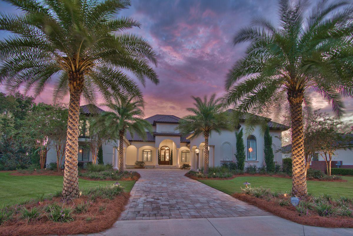 Sweeping lake views paired with prominent positioning within the gated enclave of Kelly Plantation define this immaculate mediterannean retreat masterfully constructed by Boswell Builders in 2018. Captivating architectural elements provide a stunning exterior facade while curated interior appointments allow for optimal comfort and easy living to enjoy all that Destin's most prestigious golf course community offers. Notable features include a spacious four car garage, magnificent open floorplan with 12' ceilings throughout, a custom wine cellar and ideally layed out with 95% of the layout situated on the first level including the oversized master suite which also has direct access to the lake front resort style pool deck and outdoor living area. This home offers an opulent sense of arrival with a private parking court flanked by four oversized garage bays and covered porches. The first floor features a private office suite next to the sizable master bedroom which overlooks beautiful lake vistas and offers a sitting area, sizable walk-in closet with custom built-ins and a stunning southwestern orientation that takes full advantage of summer sunsets. The spa-like master bathroom is well equipped with dual vanities, a soaking tub and a beautifully designed walk-in shower. The chef's kitchen is a centerpiece and the heart of this lovely home complete with custom Wolf and Sub Zero appliances including a gas range, double oven and dishwashers as well as custom cabinetry complete with hidden pantry and subsequent prep kitchen. The kitchen is open to the living and dining areas which flow effortlessly out to the screened lanai. The outdoor living area is impactful and features a resort style pool and spa along with a sprawling outdoor kitchen and living space including heated and cooled storage for beach toys as well as access to the lake frontage behind this beautiful home. There are multiple guest suites as this home is fit for entertaining; each guest suite offers an adjoining private bathroom as well as easy access to the main living areas. Other notable features include a custom wine cellar with additional wine storage, a commercial sized laundry area, full home automation including security cameras and remote operation as well as a spacious second story guest suite with additional room for storage in the well insulated spray foamed attic. 

Kelly Plantation is a highly regarded as one of Destin's prominent golf course communities with excellent proximity to world class amenities including Legendary Marina, the Destin Commons, Whole Foods as well as an array of shopping, excellent dining options and local entertainment.