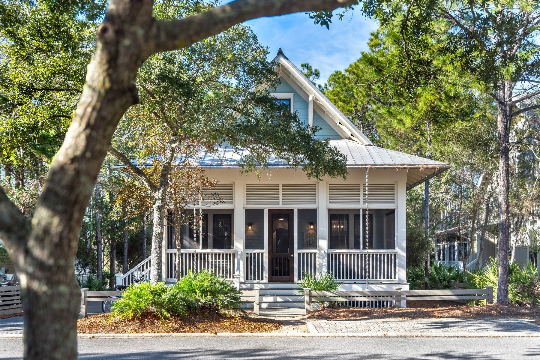 Nestled within the prestigious confines of WaterColor's serene community and set on a tranquil street near Camp WaterColor, this inviting beach house embodies the essence of family-friendly living with its charming blend of hardwood floors, shiplap walls, and expansive 700 square feet of breezy porches that seamlessly integrate with the surrounding natural beauty.

This home backs against a lush nature preserve offering a canvas of possibilities, including the option to add a private pool. Renovated in 2020, the home now boasts a spacious laundry/mud room, a stylish half bathroom with a sliding barn door, and expanded outdoor living areas. This home backs against a lush nature preserve offering a canvas of possibilities, including the option to add a private pool. Renovated in 2020, the home now boasts a spacious laundry/mud room, a stylish half bathroom with a sliding barn door, and expanded outdoor living area. 

Step onto the screened front porch, where a serene atmosphere invites you to unwind on the swinging bed, embraced by the gentle coastal breeze and Sonos speakers to enjoy music as you relax. Inside, discover a thoughtfully designed living and dining area, alongside a gourmet kitchen adorned with quartz countertops, top-of-the-line Thermador appliances, and a farmhouse sink. The wine cooler stands ready to elevate your gatherings with family and friends, while a versatile office nook adds functionality to the space.

Transition seamlessly from indoor to outdoor living through the covered porch, perfect for al fresco dining and entertaining against a backdrop of natural beauty. The first floor hosts two bedrooms, including a tranquil master suite overlooking the wooded landscape, complete with a luxurious soaker tub, separate shower, and walk-in closet adorned with built-ins. A private screened porch offers a secluded retreat for morning coffee and birdwatching.

Upstairs, two additional bedrooms, making this home a sought-after destination with a proven rental history. Miles of bike paths connect tennis and pickleball courts with parks and watersports on Western Lake. The private Beach Club offers laid-back gulf-front dining, three pools and direct access to the Gulf of Mexico. Closer to home, Camp WaterColor has a lazy river, additional pools and enough water slides to make this a vacation paradise.