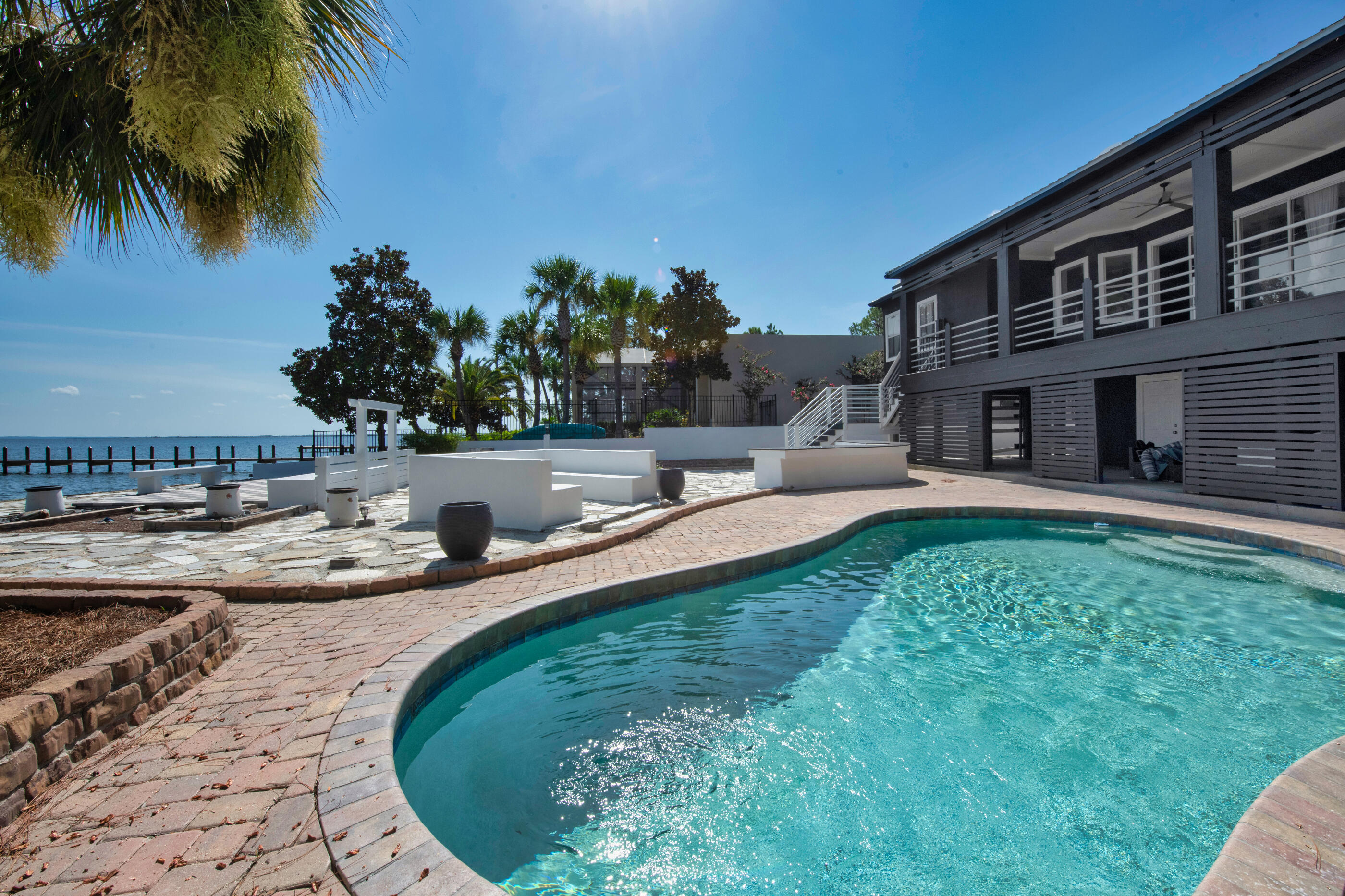 3 Bedrooms plus Bonus room with a private pool discover your Dream Beach House.everything needed for a Mediterranean coastal lifestyle,No HOA 2025 metal roof,Mediterranean bathroom  style all LED lightning and retrofit, got to love the water view barbecue area with the fire pit for all you family and friends to enjoy the beautiful sunset 10  minutes away to the white sand Beaches  30A,  and  shopping center grand boulevard and just miles away to Grayton beach and rosemary beach, this House offer everything you needed to make it your primary home or your vacation home.