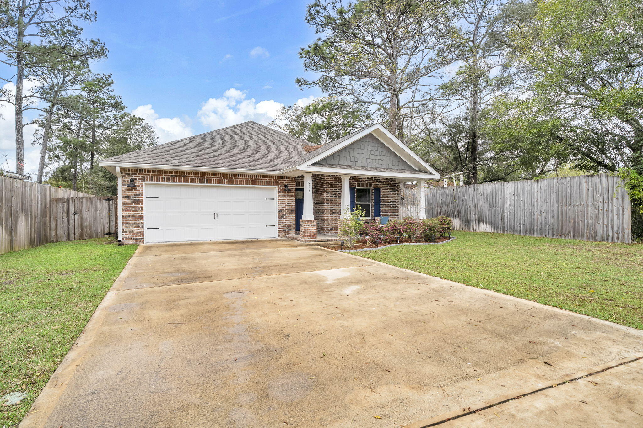 VA assumable loan 4.625%! Great, local builder built this home in year 2022! This home features  4 bedrooms, 2 baths, 1866 sq ft. and is located within minutes from some of the top tier schools in the state of Florida, military bases, restaurants, and shopping! This home is zoned for Elementary (Bluewater), Middle School (Ruckel), and High School (Niceville) and is conveniently located to Eglin Air Force Base, 20 to 30 minutes to the stunning, Destin beaches, several minutes to local parks, bayous, and outdoor activities. This craftsman style home features all the luxuries of modern living including an open concept layout! The kitchen features solid wood shaker cabinets, Granite countertops, a stylish 3x6 white subway tiled backsplash, and a very spacious corner pantry. The kitchen island has modern, custom pendant lighting, seats up to four guests, a large granite slab counter top with an undermount sink and has a decorative shiplap wood facade. There are stainless appliances to include a French Door refrigerator, slide in stove and oven, built in microwave, and dishwasher. The custom cabinetry has crown, large brushed nickel hardware, and soft close drawers. The flooring throughout the common areas of the home is Luxury Vinyl Plank flooring. The kitchen opens to the dining room and large living room. The living room has trayed ceilings, recessed lighting and large picturesque windows allowing natural light! The primary bedroom also has trayed ceilings and an ensuite bathroom with a double vanity and large walk in shower with semi frameless glass doors and custom tile. There are two custom mirrors, newer lighting, and a rain head showerhead. The shower is tiled with brick lay format and has a shower niche. The primary bathroom features an large walk in closet with built in shelving. There are three additional bedrooms and a full guest bath. The back porch is covered and a perfect retreat overlooking the fenced, backyard. Grilling under the covered patio is perfect for entertaining. Hot water heater, HVAC, and Roof 2022 year. Insurance will be affordable on this newer home! No flood insurance required. Other exterior features of the home include: gutters, brick and custom wood columns, grey shaker siding, fenced yard, and sprinkler system. Additional interior features include: blinds, crown molding, base molding, modern millwork around windows and doors, and new interior raised panel doors. Buyer to verify all dimensions and information.