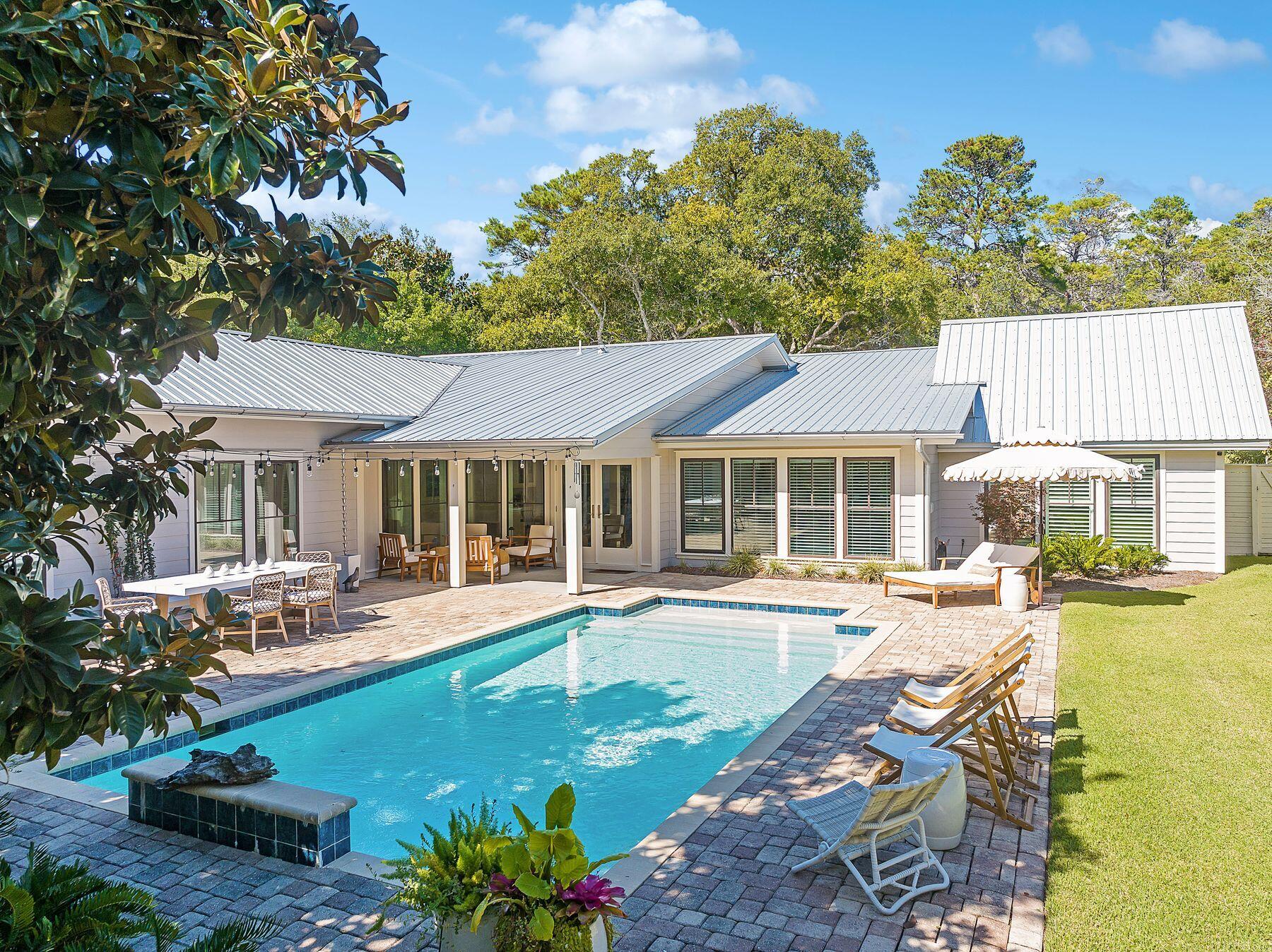 A quintessential Old Seagrove home boasting the best of the original intention with a new addition tastefully done in 2014/2015 to a beach cottage look that fits all your family memories. Contractor's affidavit documenting complete renovation of the home in 2015.

Crafted as a single story home with four bedrooms and three baths, the split plan allows the kids to be on one side of the home and the parents on the other. Central dining and living along with the kitchen open to what is a masterpiece entertaining back yard with an over-sided pool not often found along 30a and yard to spare.