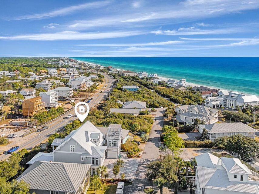 Priced to Sell! Projected gross income of $370,000. Currently rented a portion of the year.

Introducing a rare opportunity for discerning investors seeking a stunning estate that embodies coastal opulence and proven rental income potential. 

This tri-level estate boasts mesmerizing 180° gulf views from the second and third floors, and roof top deck!

Positioned just two minutes from Beach Highlands neighborhood deeded beach entrances with 1,000 feet of beachfront.

 This incredible residence features seven  bedrooms and seven and two half bathrooms, including a detached carriage house above the garage. Indulge in resort-style living with a state-of-the-art kitchen, complete with a wet bar, wine storage, and two high performance kitchen.

Ascend to the rooftop sundeck and revel in panoramic views of the glistening Gulf waters. A private elevator, and an expansive outdoor oasis with pool side linear fire place, spa, recessed sun loungers in pool platform; outdoor designed for entertainment and relaxation. Unwind in style at the swim-up bar, savor outdoor meals from the gourmet outdoor kitchen, and bask in the sun on sleek poolside chaise lounges.

Entertaining is made easy with a Sub Zero 48'' refrigerator, Wolf SS 48'' dual fuel gas range, custom vent hood, convenient pot filler and coffee station. The opulent kitchen island with its waterfall marble countertop provides added seating. Step from this area through gorgeous Euro doors into a large, covered lanai bringing the outdoors in with a lovely transitional area with a resort style pool, incorporated hot tub and waterfall feature that flows into the shallow area with sunbathing ledge. 

It's an easy stroll through the pool or swim up to the submerged bar seats that adjoin the bar and sunken outdoor kitchen. The stunning outdoor kitchen comes with a BBQ grill and Big Green Egg, soda cooler, ice maker and sink. After an evening swim, gather by the lovely, modern fire pit. Finally, retreat for relaxation in the primary king suite featuring french doors that open to the lanai and a sumptuous ensuite with a double spa shower and soaking tub. 

This floor also hosts an additional queen bedroom. Serene colors, calming textures, shiplap accents, designer lighting, and natural wood elements continue throughout the home. The second-floor wraps guests in luxury with three king bedrooms; each featuring its own private ensuite baths. One bedroom includes a small workout room with Peloton. The third and final level of the main house features a capacious family Room with a queen sleeper, covered porch access, and crisp white Bunk Room featuring two twin over twin Bunks with a shared bath/shower combination. The third level offers a private office suite with full kitchen and bath that could be converted to a seventh bedroom. Whole house GENERAC generator.

Currently on Echelon's rental management program with a proven track record of income and room for more. All furnishings to convey.