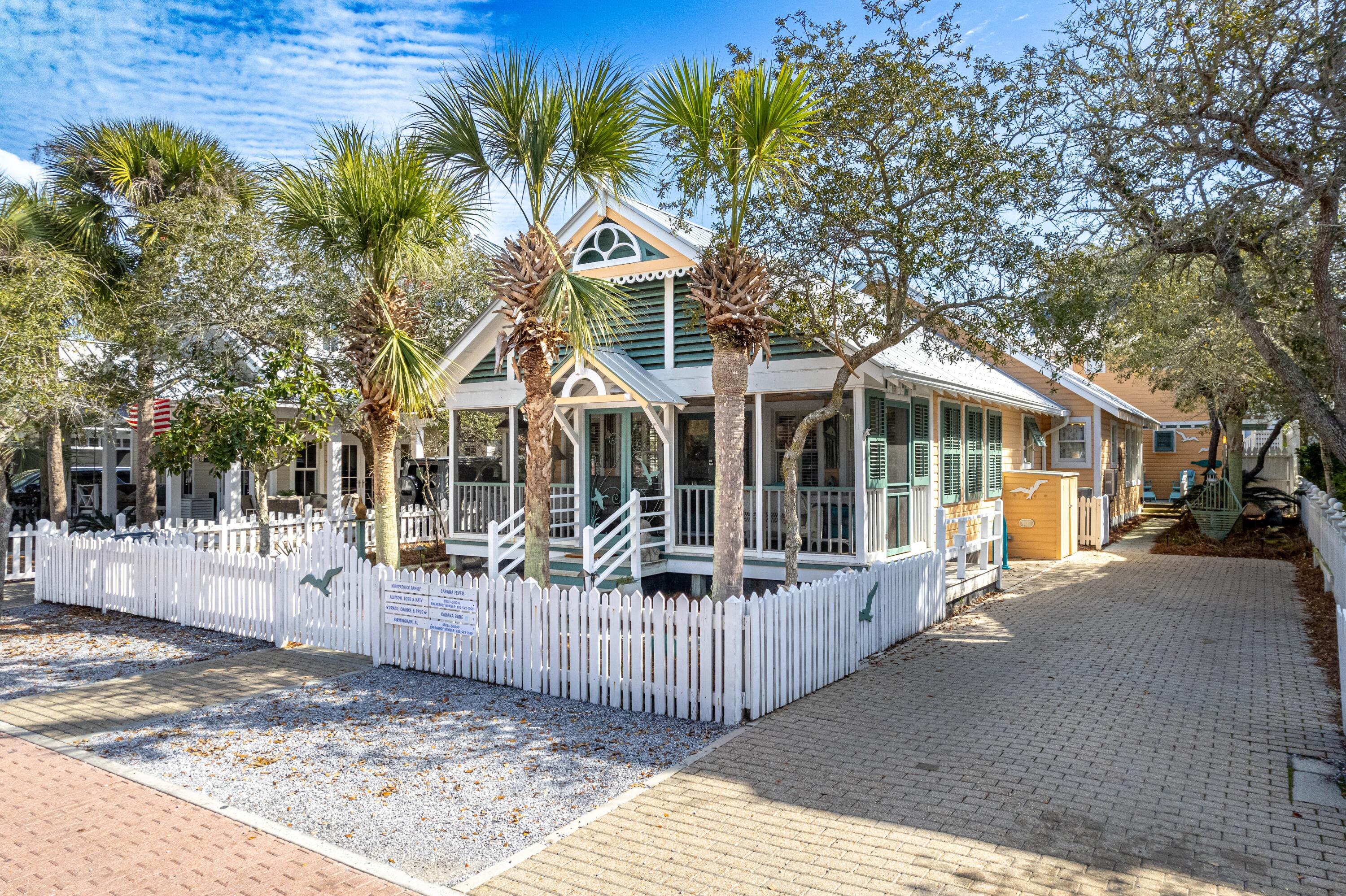 It's location, location, location! Nestled three lots back from iconic scenic 30A, these immaculately maintained beach cottages are a stone's throw from the beach, with the west-end family pool in the opposite direction.
The one-level main house offers easy living with three bedrooms, two and a half baths, a vaulted ceiling, and a fireplace for cozy coastal nights.  Updated bathrooms and kitchen defy the one-of-a kind vintage Florida charm of this much-loved beach home. A bunk room with four bunks, and the guest bedroom share a Jack & Jill bathroom.  A well-placed skylight floods the common bathroom with sunlight. The master suite's bathroom has been lovingly remodeled with a separate shower and soaking tub to satisfy everyone's whim.  The generous front screened porch is the perfect spot to relax and visit with neighbors as they stroll to the beach. With high ceilings, ceiling fans, and beautiful vintage wicker furniture, it's an inviting space that blends comfort with timeless style. Whether you're people watching, or enjoying a glimpse of the iconic Truman House just across the street, this porch offers the ideal place to unwind.  A large attic offers plenty of storage space. And, got beach toys? Keep them securely stowed away in one of several outdoor storage units.  Plenty of deck space connects the main house to the guest cottage and creates an outdoor living area.  An over-sized driveway can comfortably accommodate a couple of vehicles.

The separate guest cottage features one bedroom, one and a half baths, and is perfect for overflow family, visitors, or rental income. This precious cottage has everything one needs for the ideal beach getaway!

Both homes are in excellent condition, fully furnished, and showcase a vintage-Florida interior, with original antique and contemporary artwork, decor, and furnishings. Updated kitchens and bathrooms provide modern convenience while maintaining classic charm.  This is a rare opportunity to own a turnkey beach retreat in a prime location.